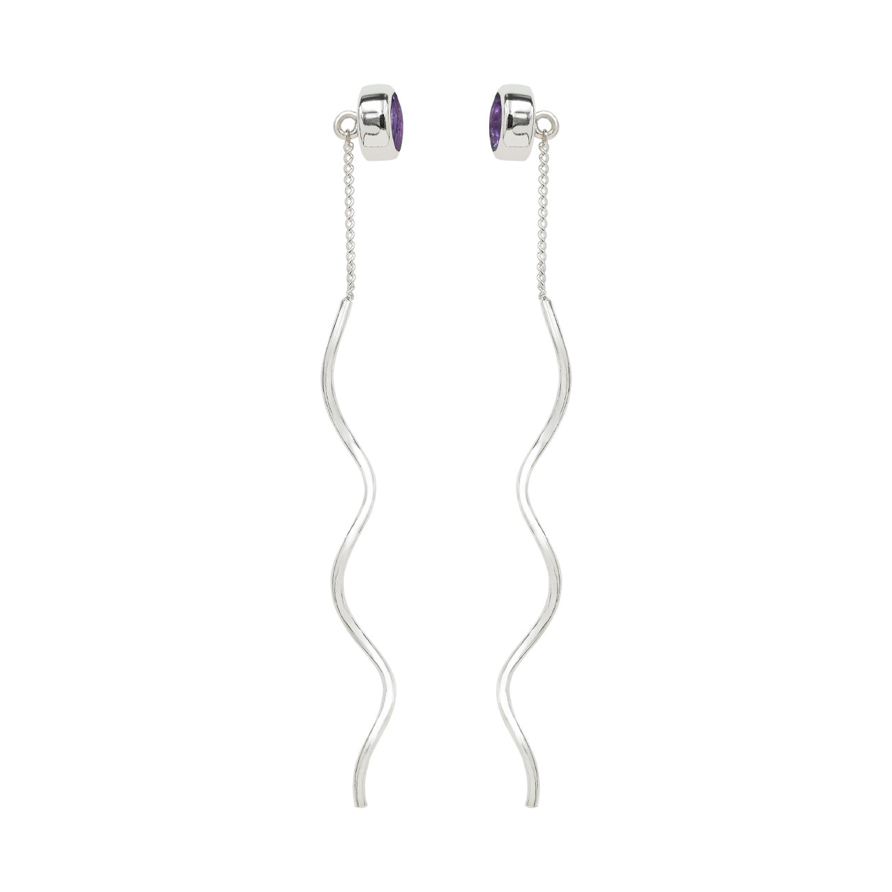 Side view of faceted amethyst stud earrings with flowing curled sterling silver wire drops showing the stone depth and the bezel setting.