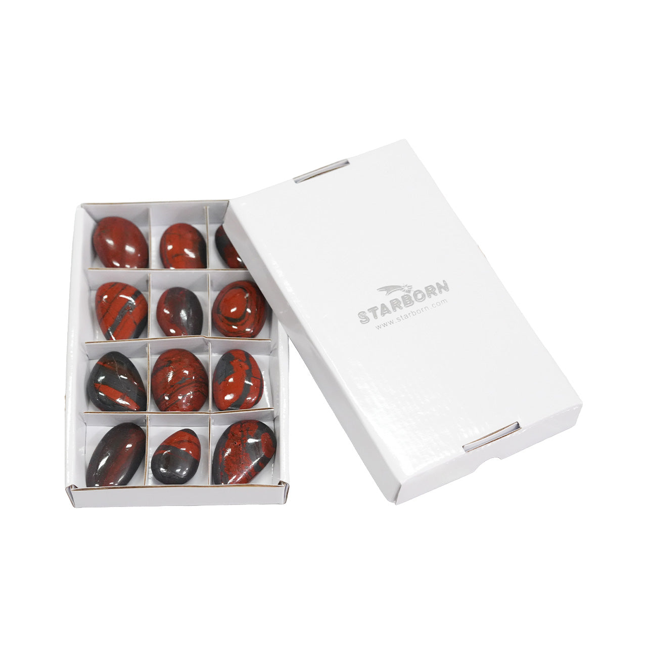 Angled view of twelve Ancestralite freeform palm stones shown with the protective storage box.