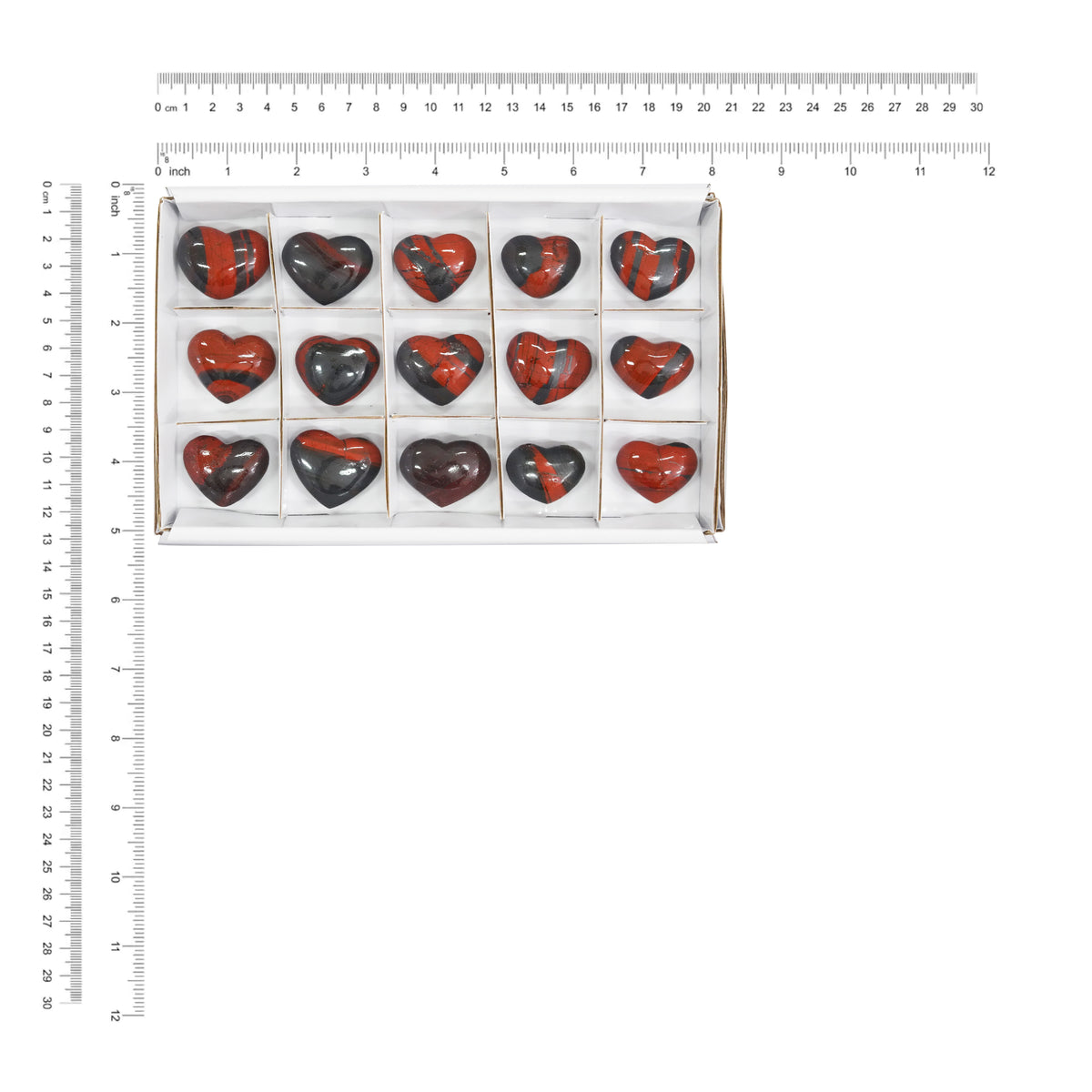 Fifteen pieces of Ancestralite heart stones displayed next to a measurement chart showing the height and width in centimeters and inches