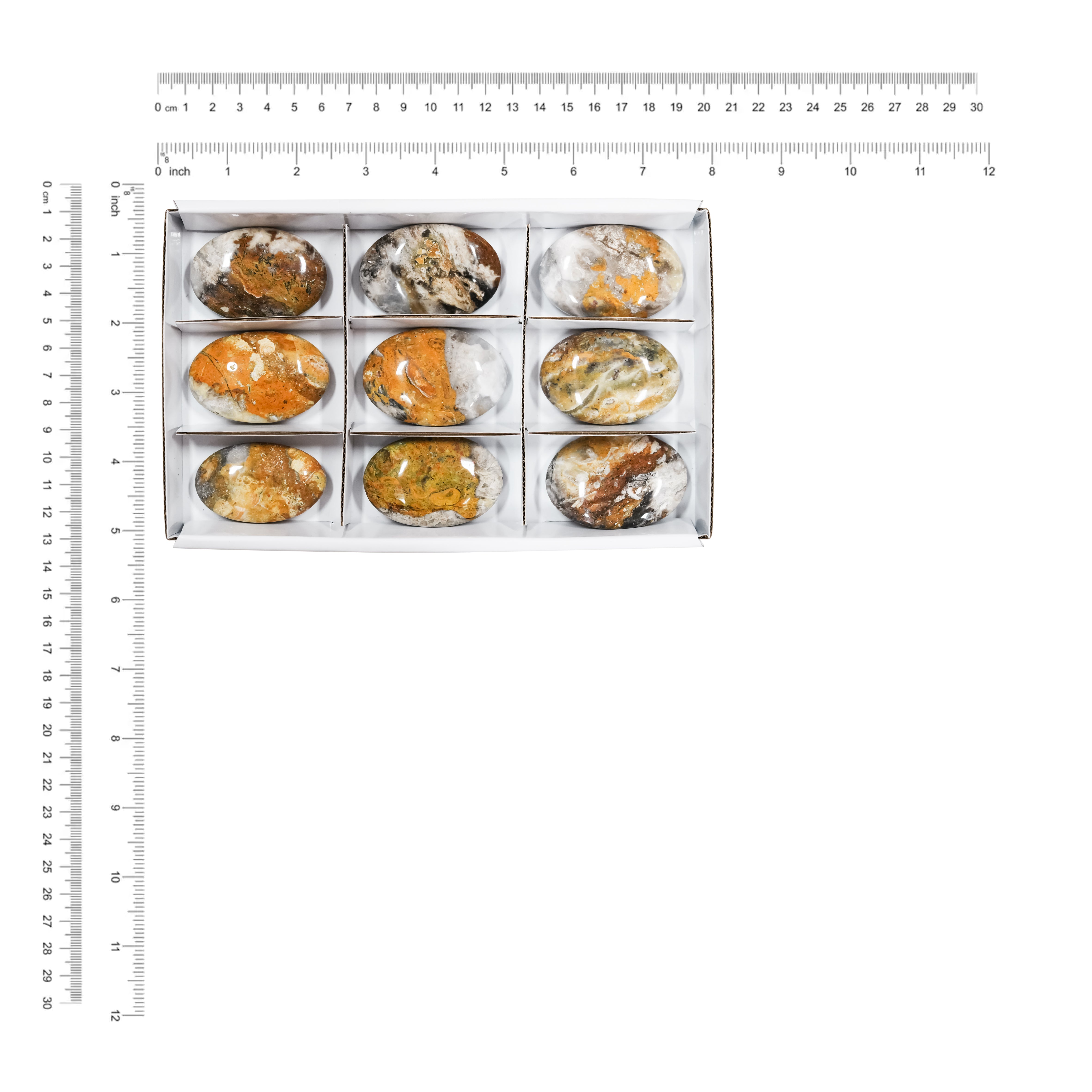 Measurement guide image showing the sturdy flat sectional box containing nine oval bumblebee jasper stones, with dimensions labeled in inches and millimeters.