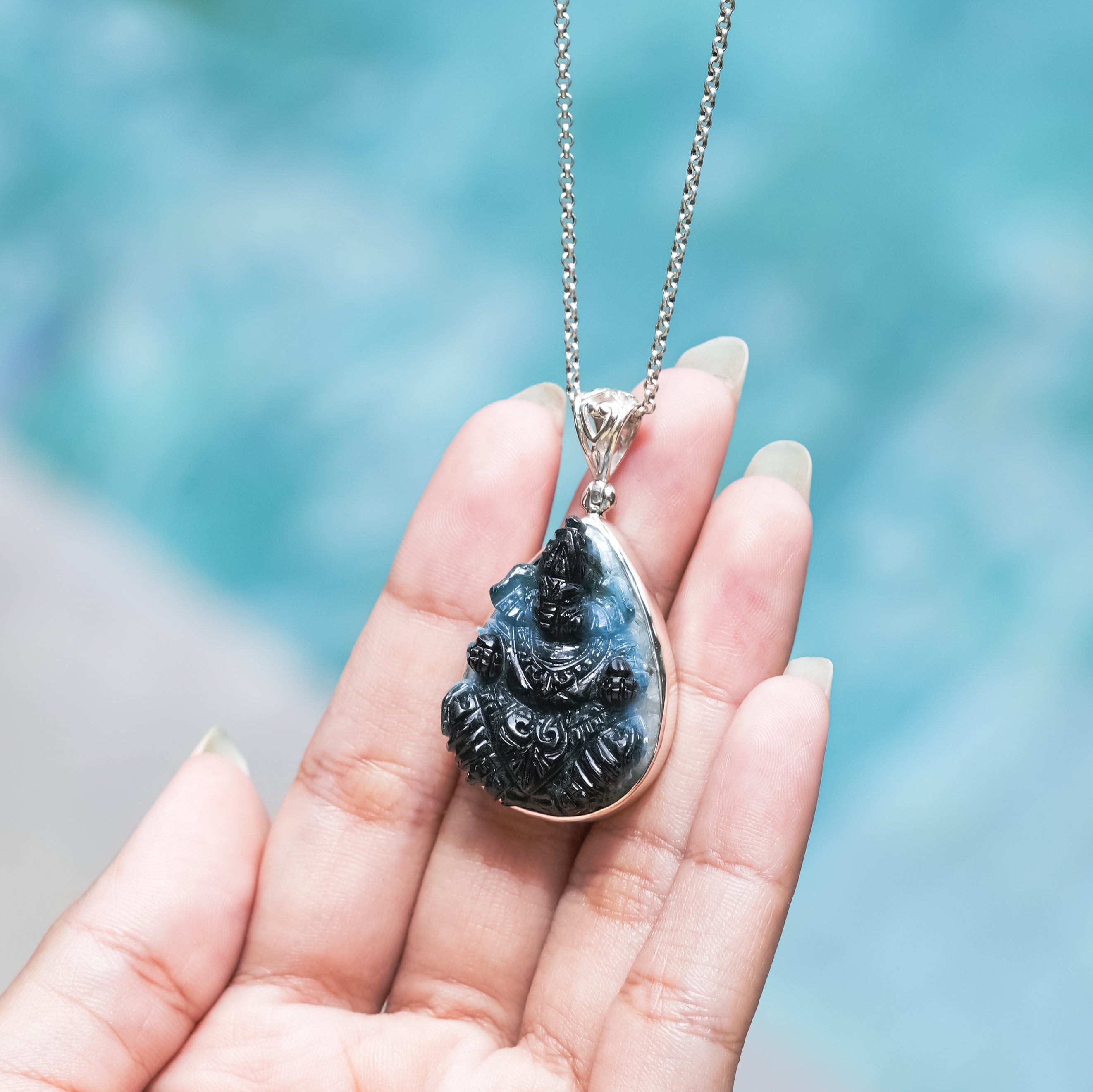 Starborn Carved Blue Ice Glacierite Ganesha Pear Pendant in Sterling Silver