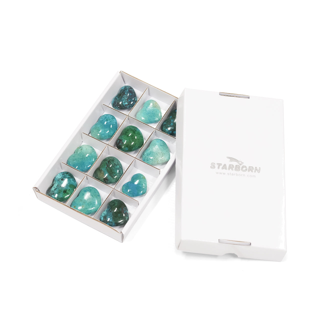 Twelve chrysocolla heart stones arranged in individual sections inside a sturdy flat box, with the matching box lid placed beside it and visible branding text on the lid.