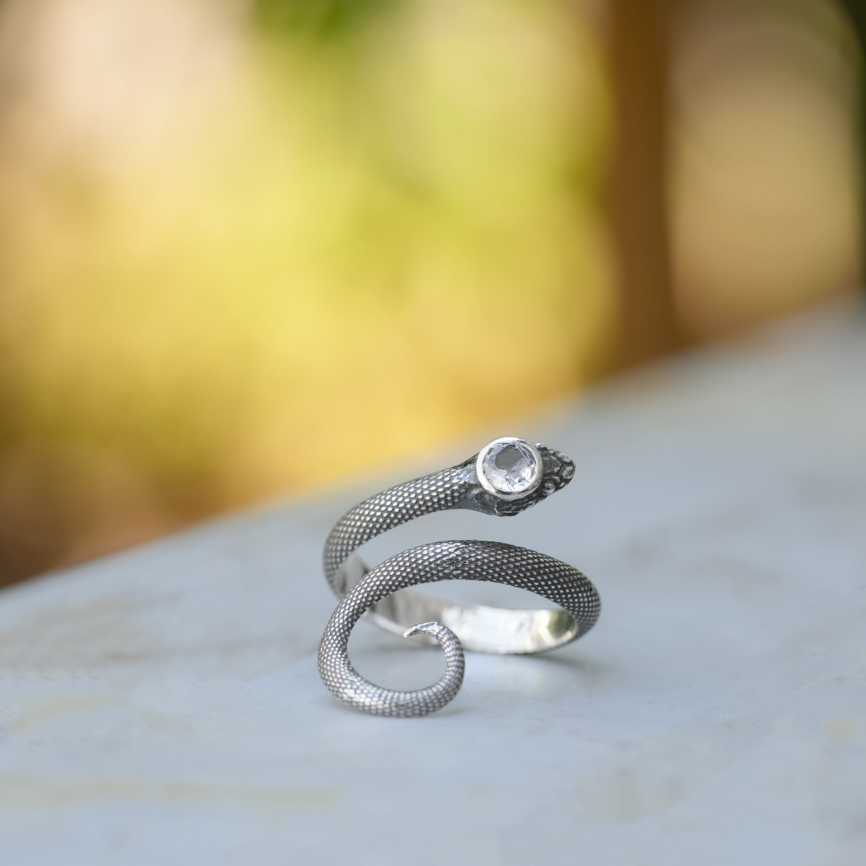 Starborn Coiled Snake Ring with Faceted Danburite in Sterling Silver