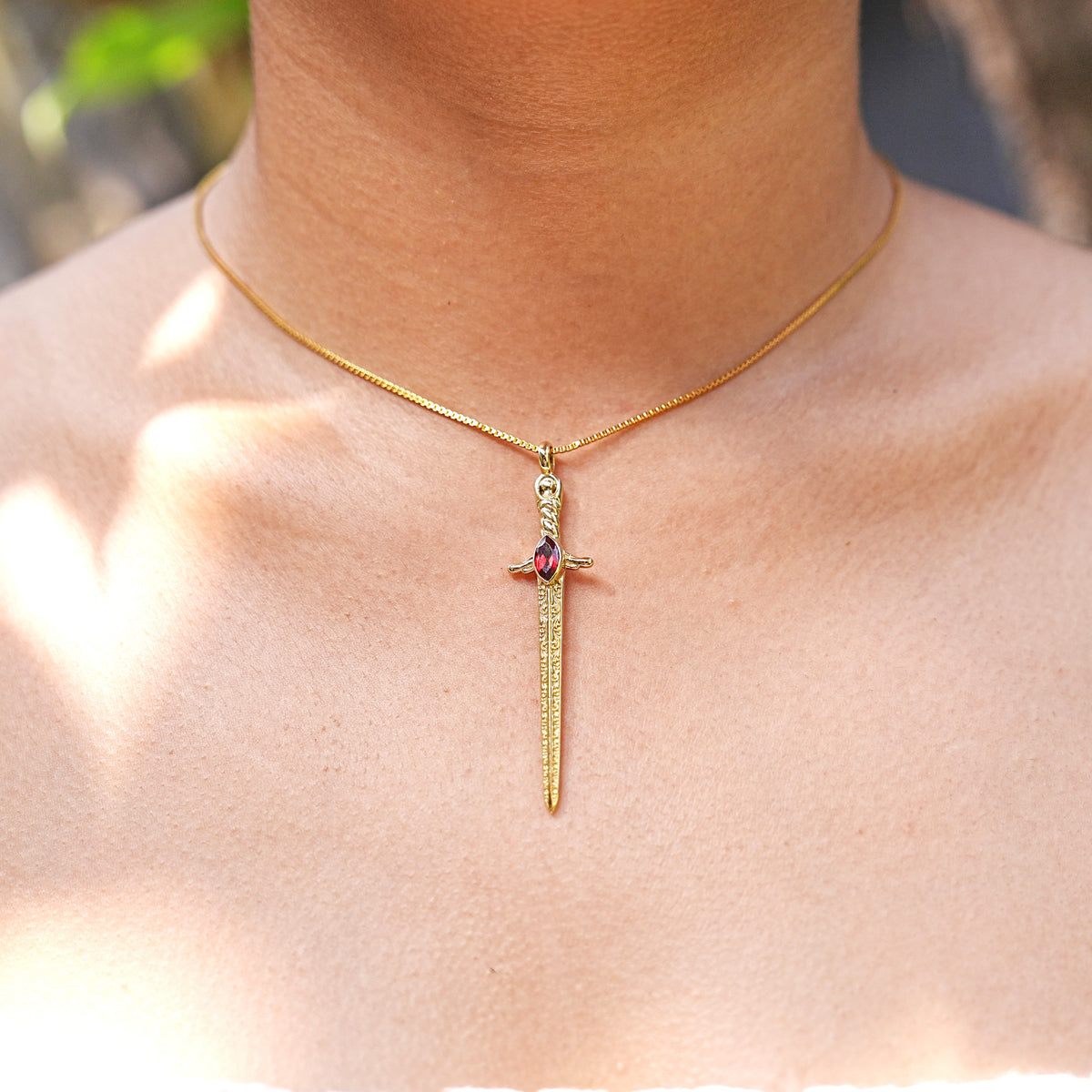 Starborn Garnet Sword Pendant