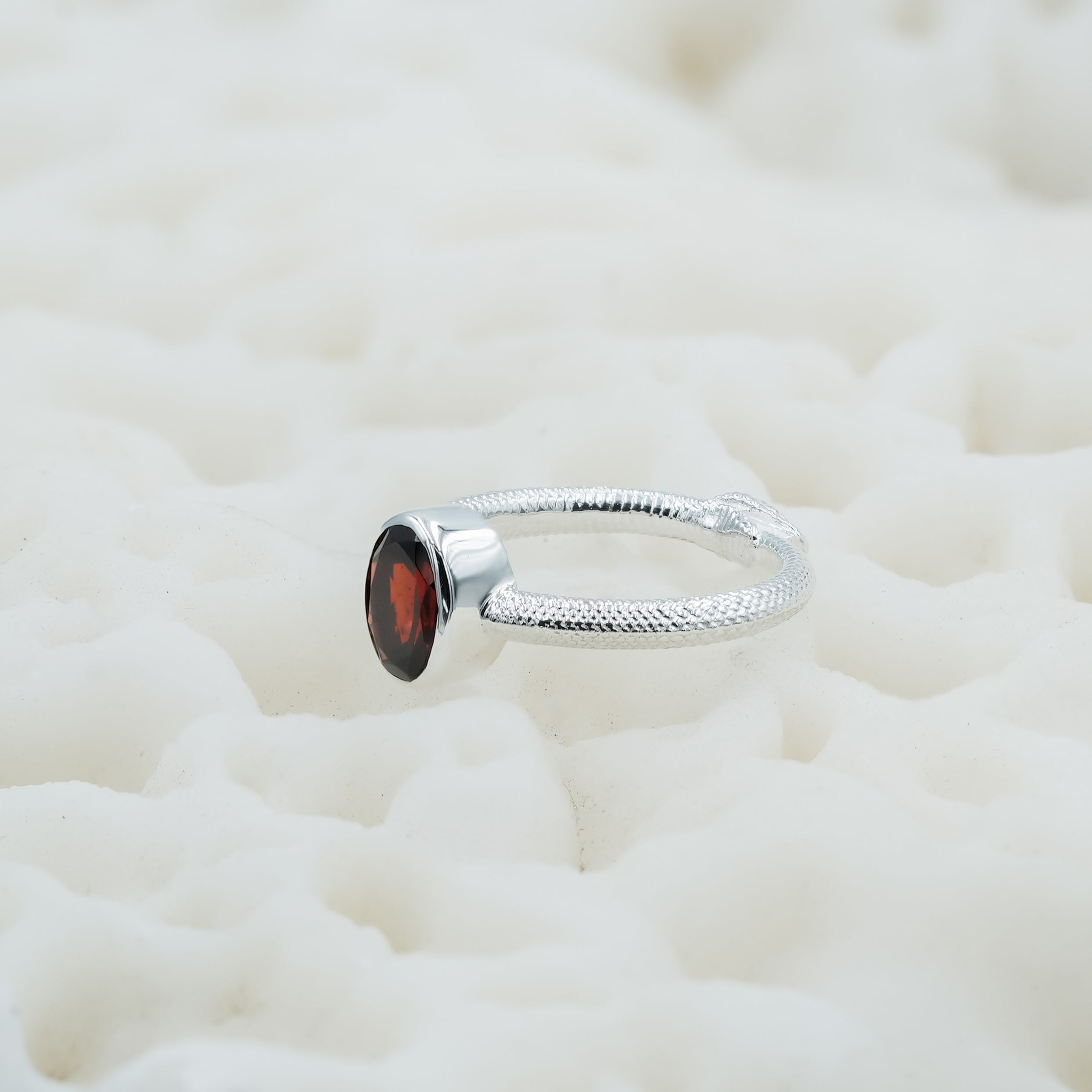 Starborn Ouroboros Ring with Faceted Garnet in Sterling Silver