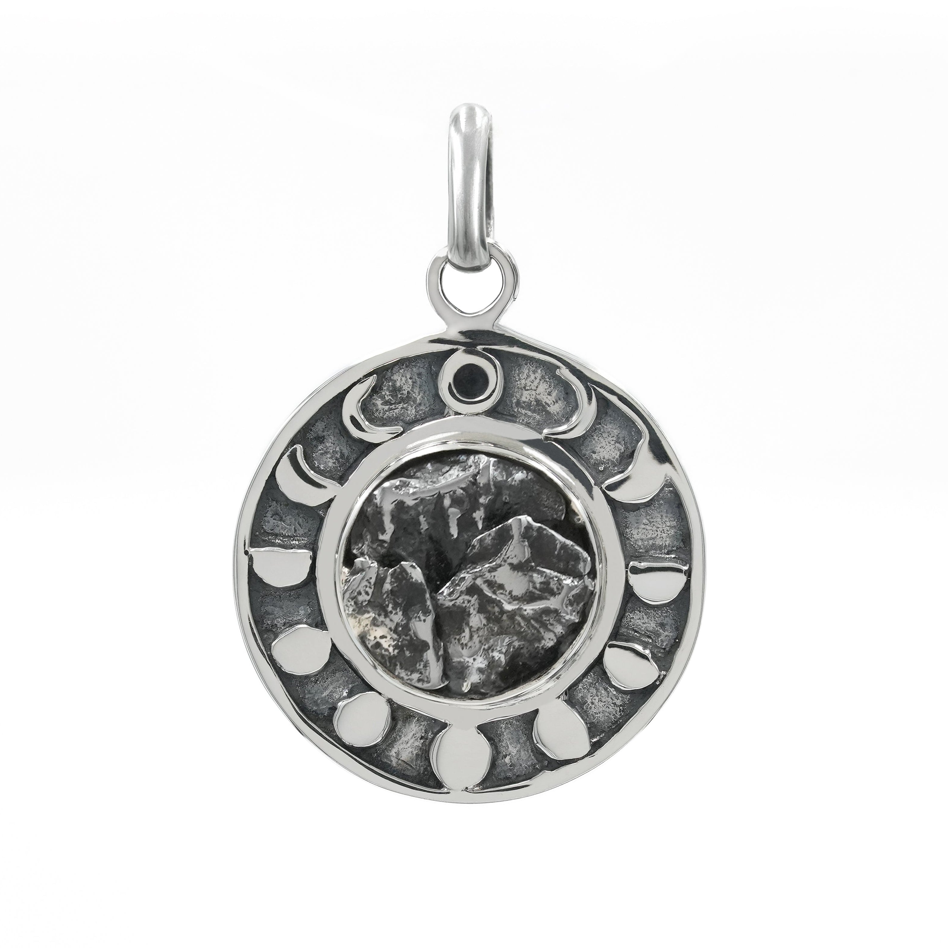 Front view of a sterling silver pendant featuring a Campo del Cielo meteorite center stone surrounded by a moon phases design