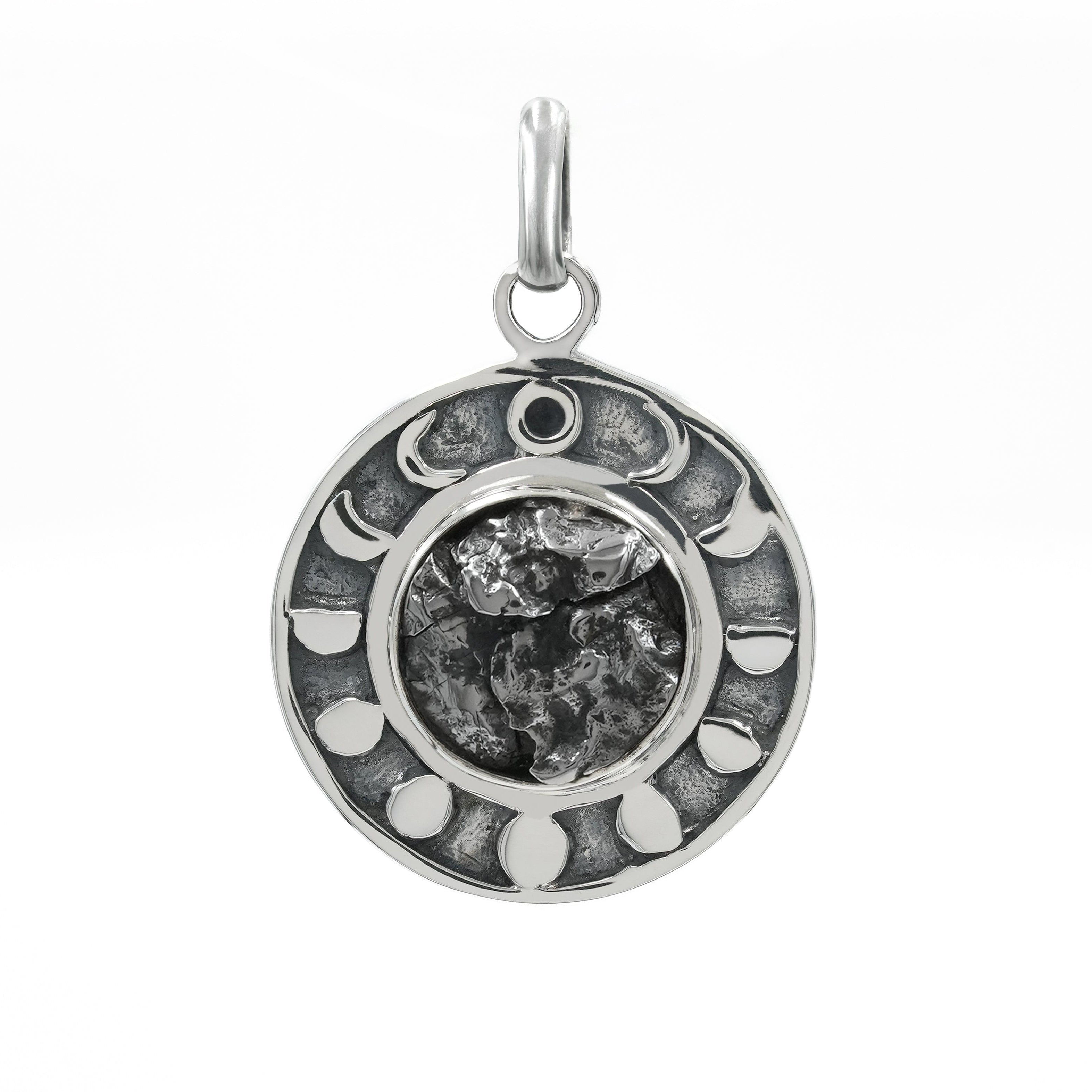 Second alternate front view of a sterling silver pendant featuring a Campo del Cielo meteorite center stone surrounded by a moon phases design