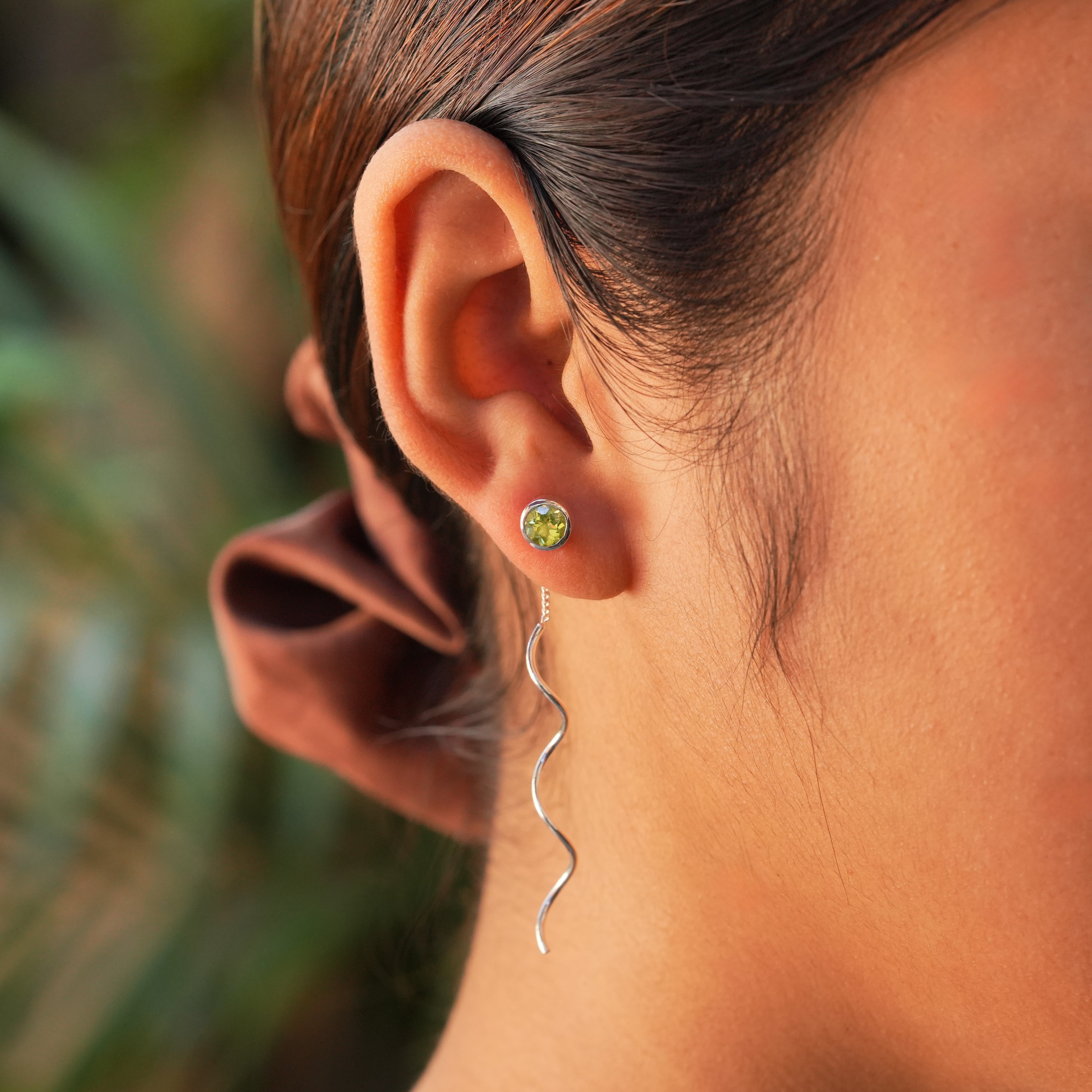 Starborn Faceted Peridot Stud Earrings with Flowing Curled Wire Drop in Sterling Silver