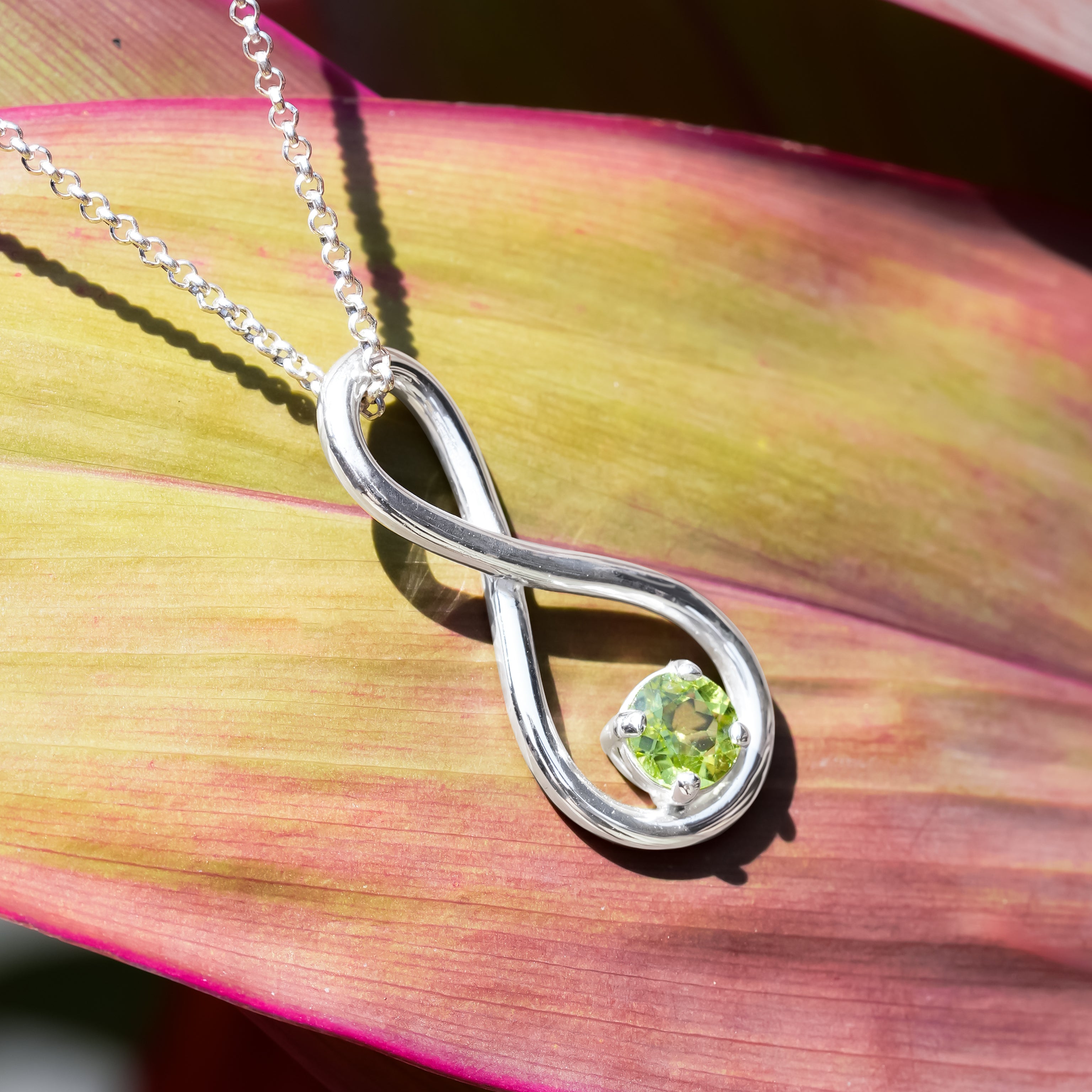 Starborn Faceted Peridot Infinity Pendant in Fine Sterling Silver