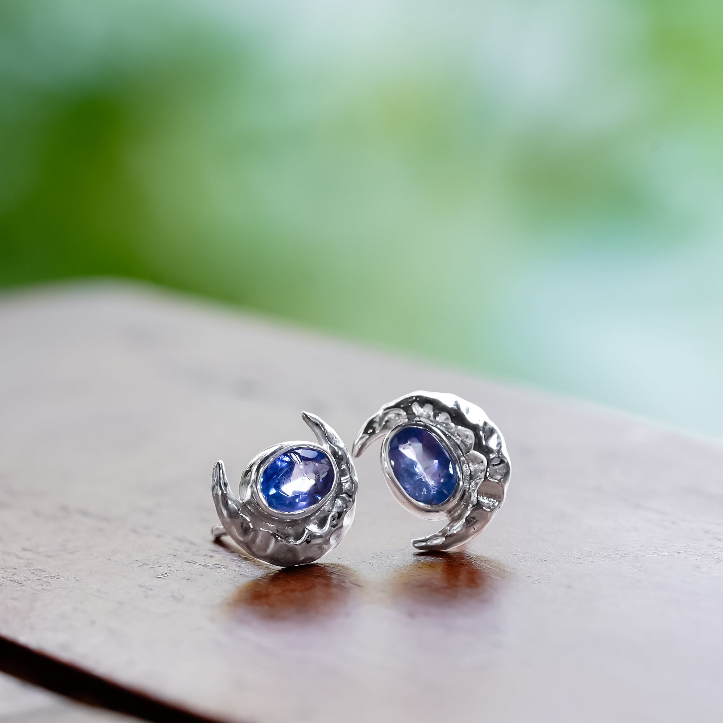 Starborn Faceted Oval Tanzanite Post Earrings with Hammered Crescent Moon Accent in Sterling Silver