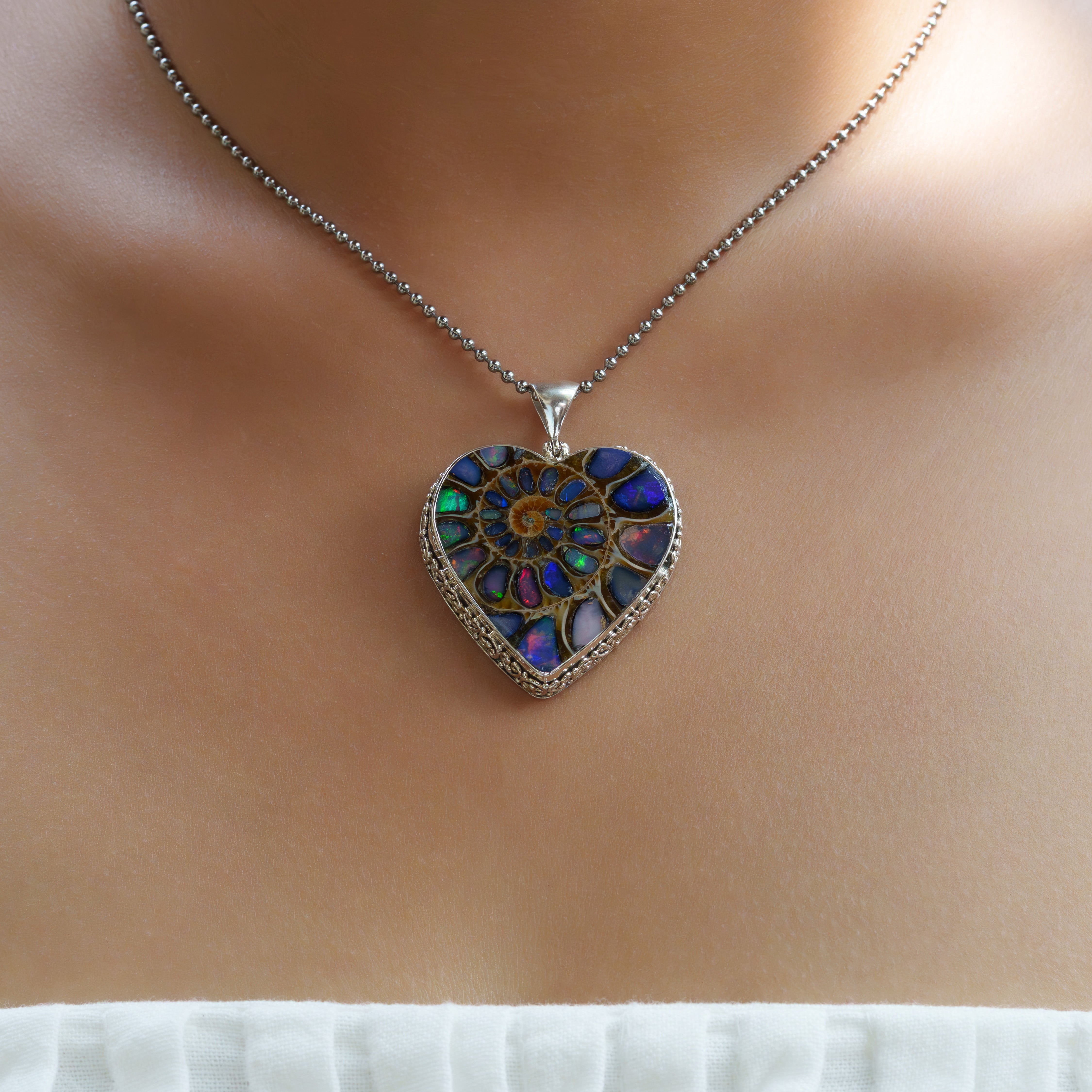 Starborn Ammonite with Natural Ethiopian Opal Inlay Heart-Shaped Pendant in Sterling Silver