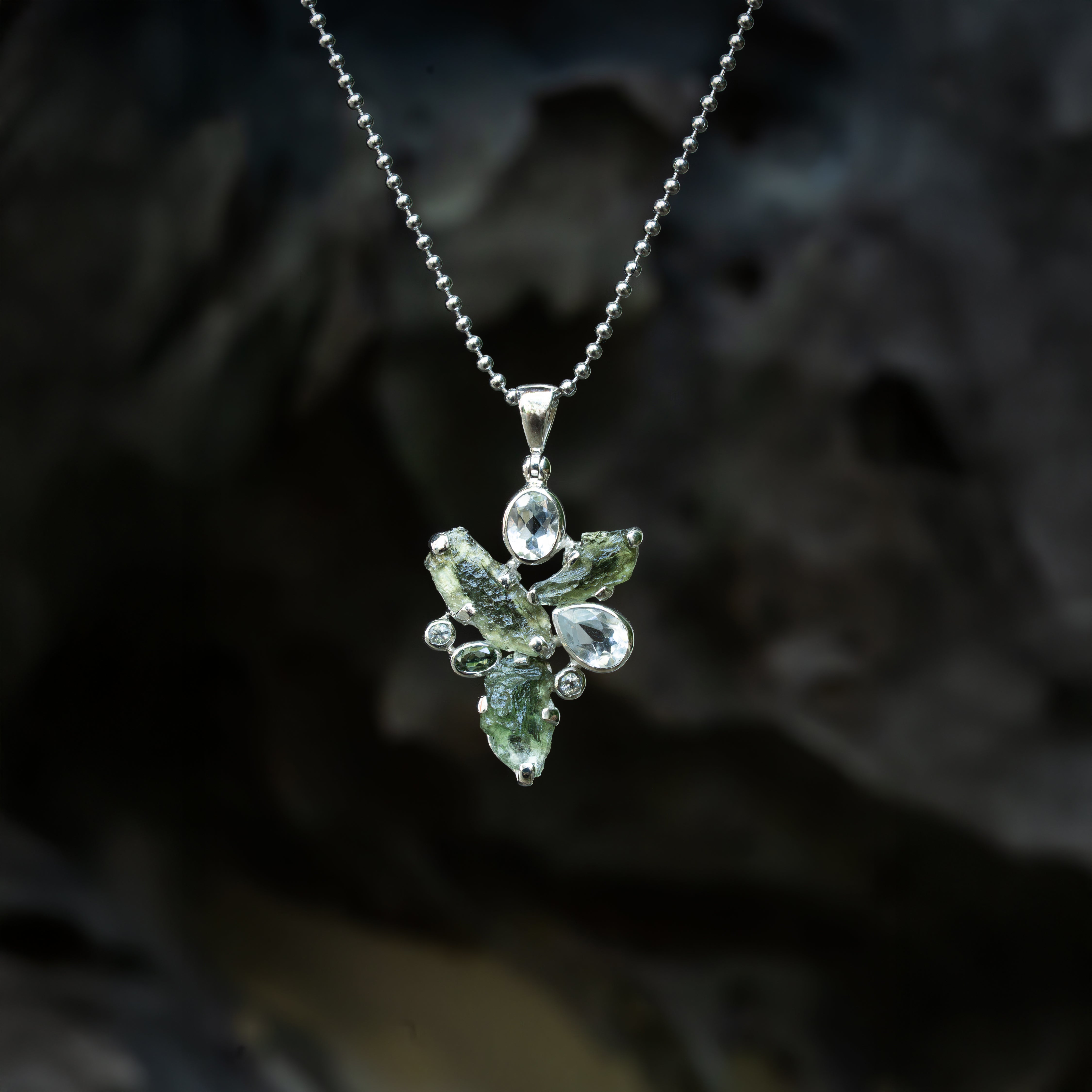 Starborn Moldavite Pendant with White Topaz Accents in Sterling Silver