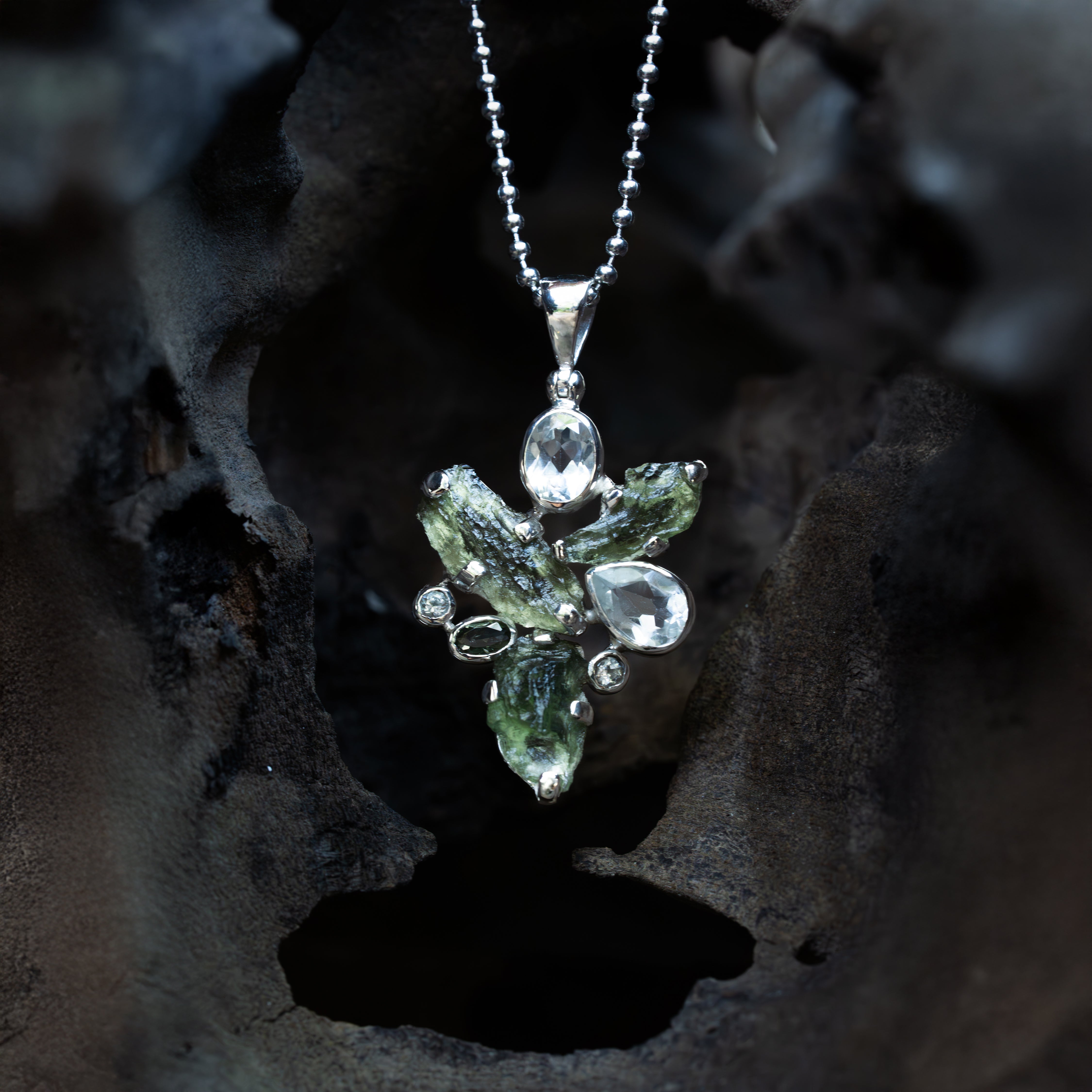 Starborn Moldavite Pendant with White Topaz Accents in Sterling Silver