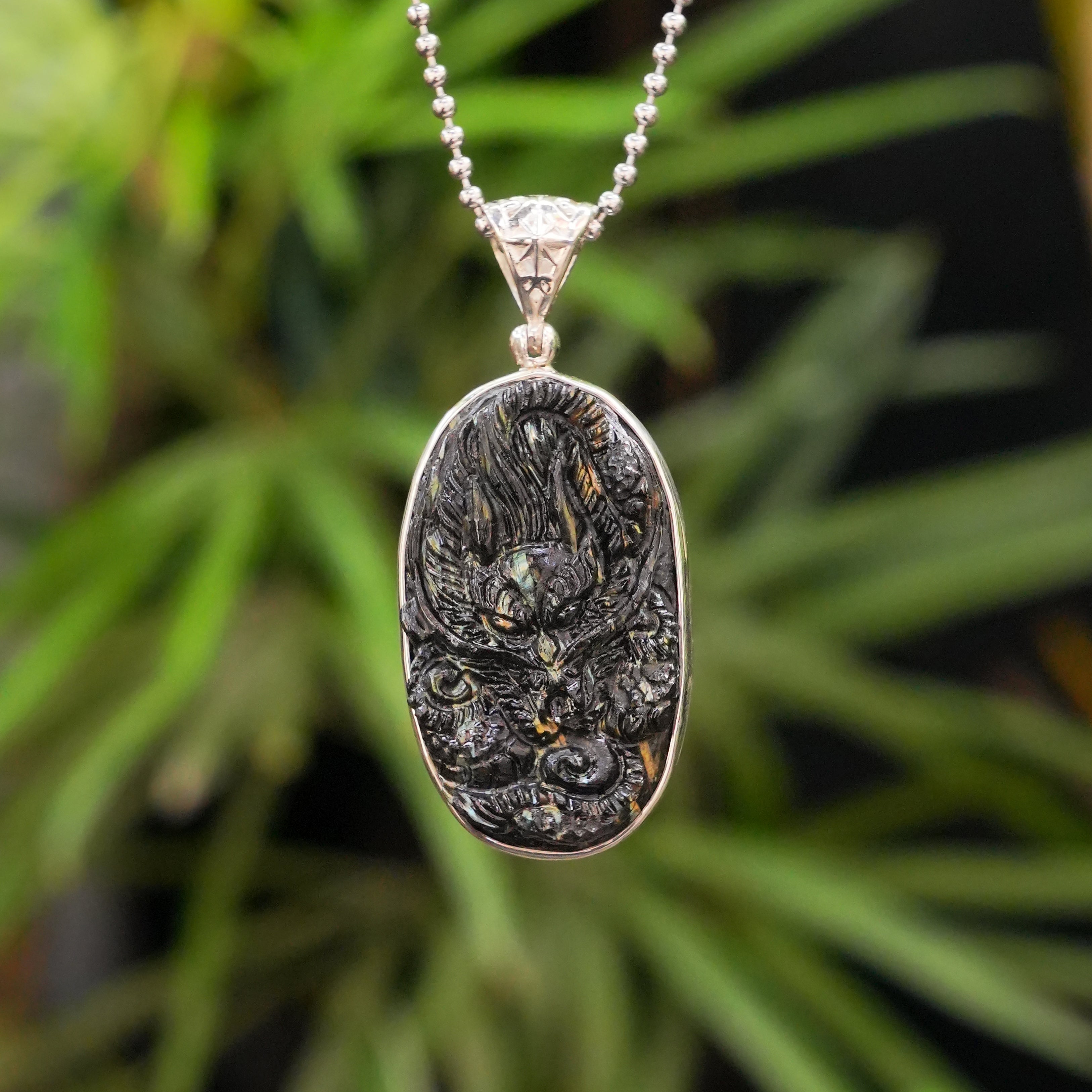 Starborn Nuumite Dragon Carving Pendant in Sterling Silver