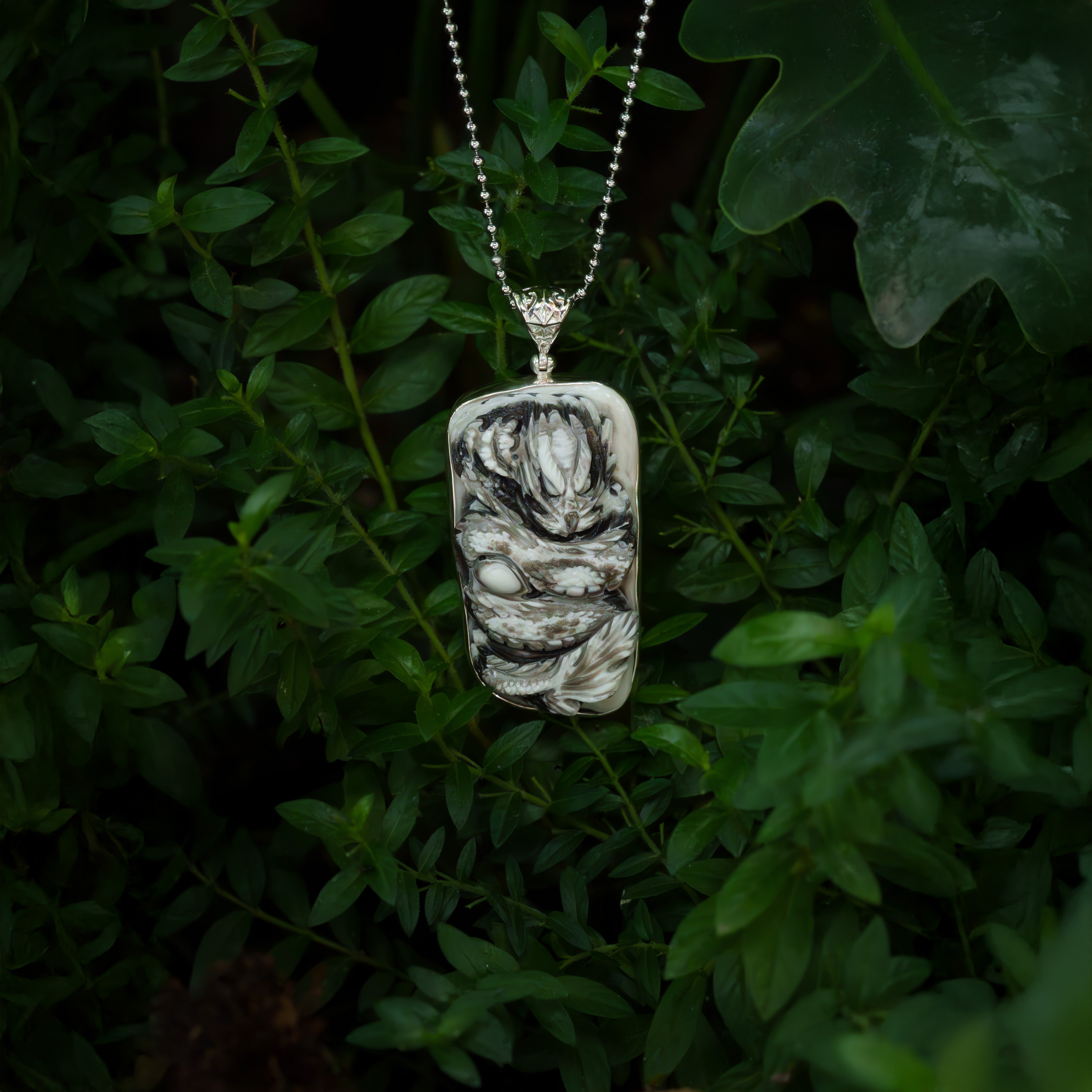 Starborn Hand-Carved Zebra Calcite Dragon Carving Pendant in Sterling Silver