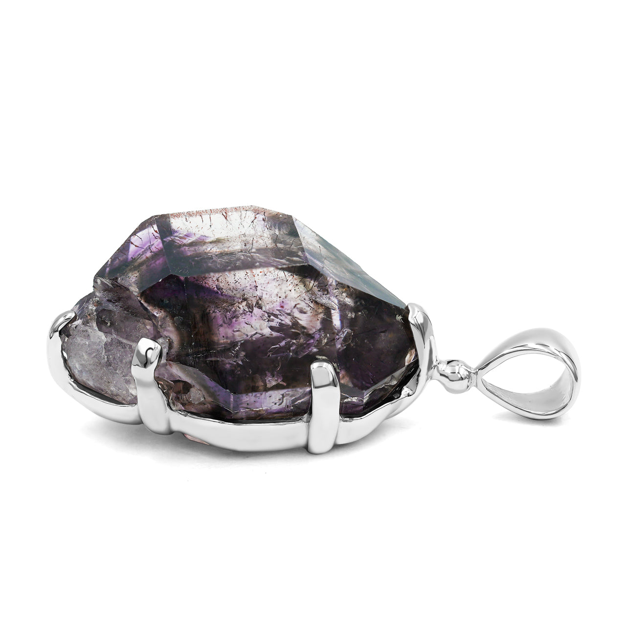 Side profile of a Shangaan amethyst crystal pendant showing the depth of the crystal and sterling silver prongs