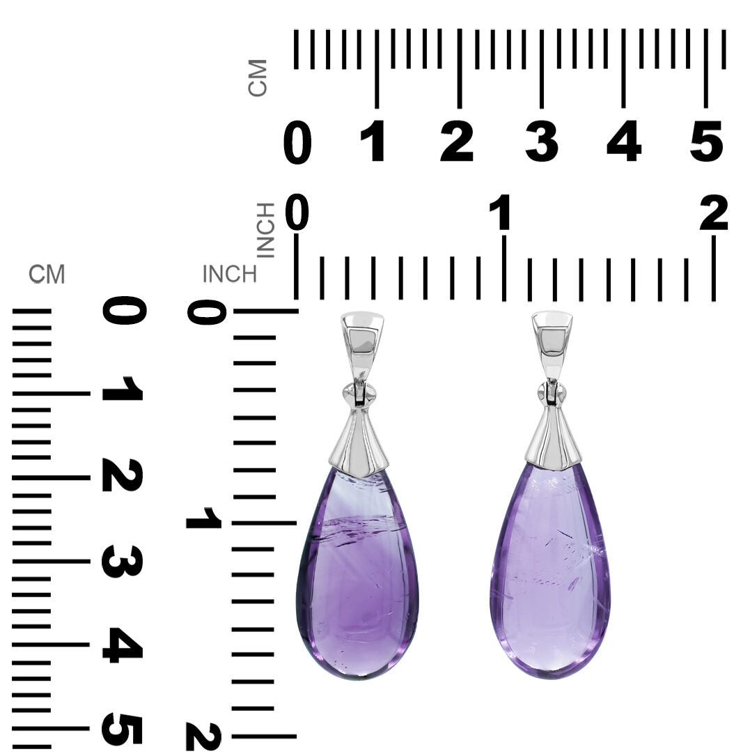 Pair of Amethyst teardrop silver pendants next to measurement chart showing height and width in centimeters and inches.