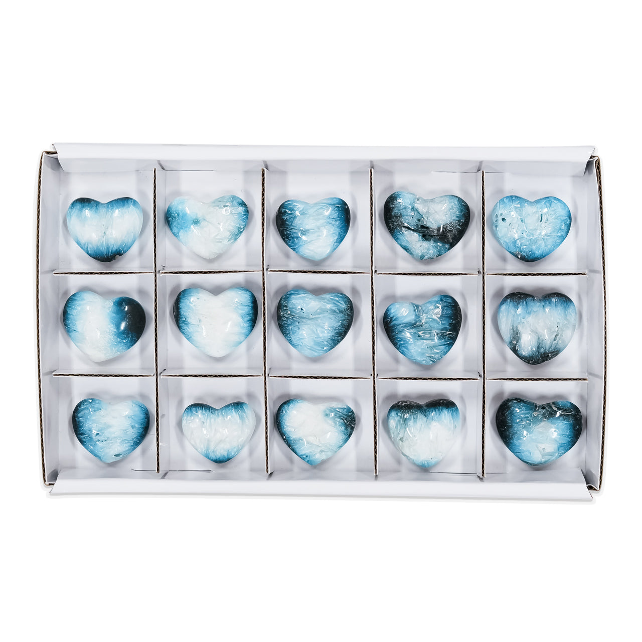 Second front‑view image of multiple polished heart‑shaped Blue Ice Glacierite stones arranged in a sturdy flat box with sections, showing smooth heart forms with blue and dark blue internal patterning. Showcasing variations.