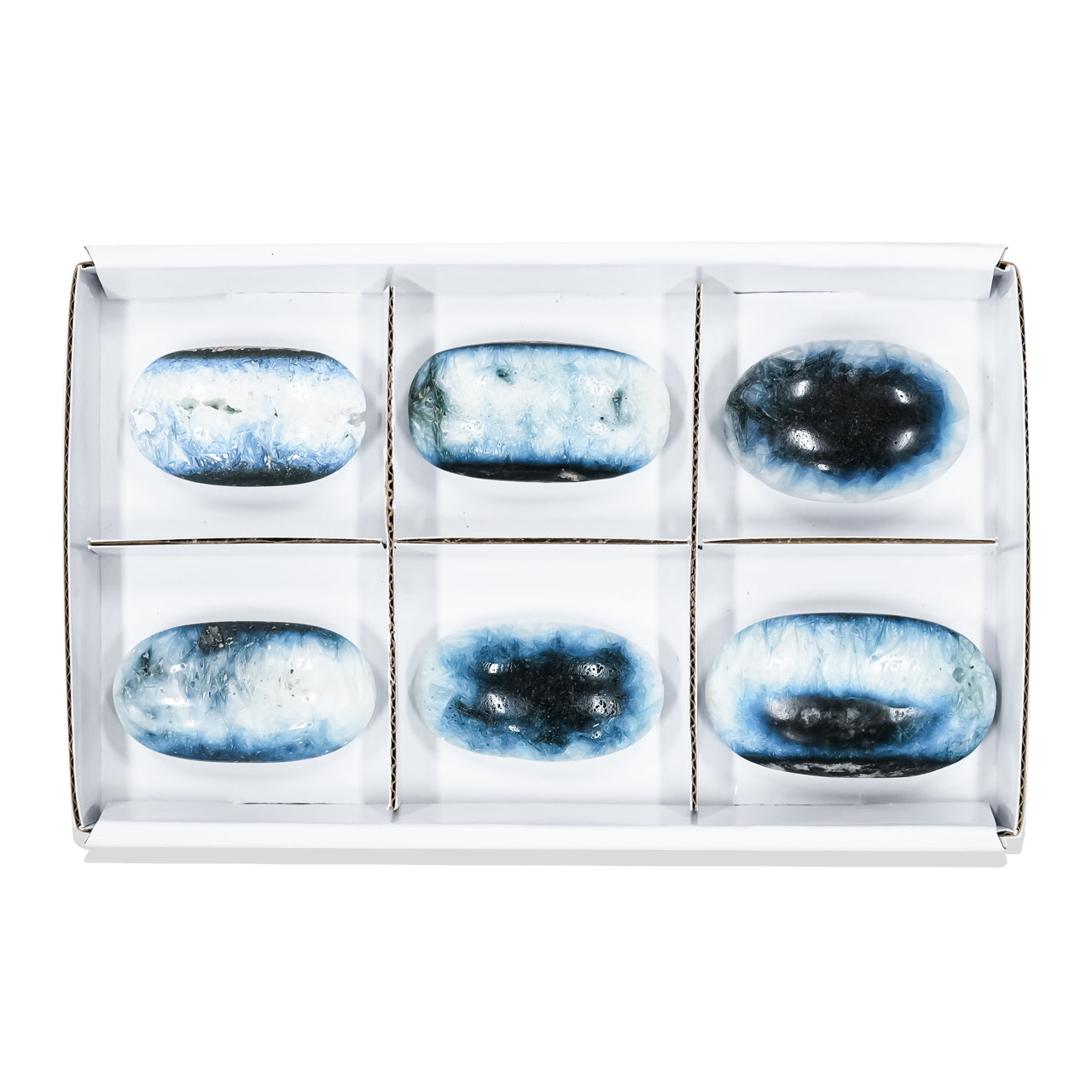 Second front‑view image of polished oval Blue Ice Glacierite palm stones arranged in a sturdy flat box with sections, showing smooth oval stones with blue and dark blue patterning on each surface. Showcasing variations.