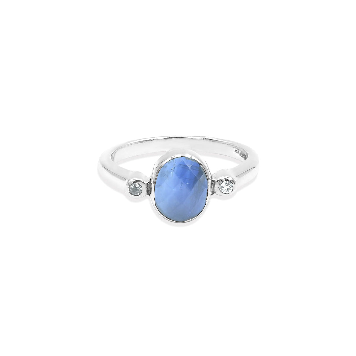 Front‑facing view of the ring highlighting the blue kyanite stone with visible internal striations and the small topaz accent set into the band.