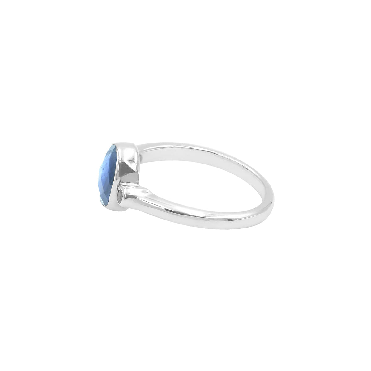 Side view of the ring showing the height of the kyanite setting, the thickness of the band, and the position of the topaz accent along the shank.