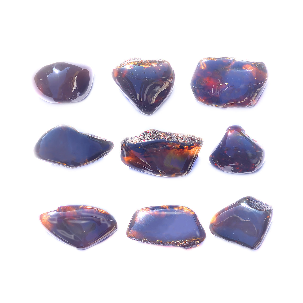 Front view of nine polished Sumatra Blue Amber collector pieces arranged in a row.