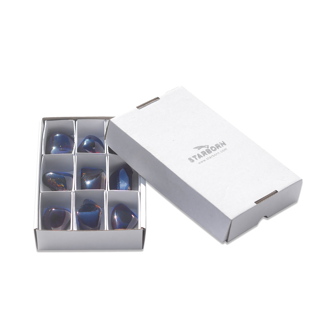 White flat box with divider containing nine polished Sumatra Blue Amber collector pieces shown beside a closed white lid.