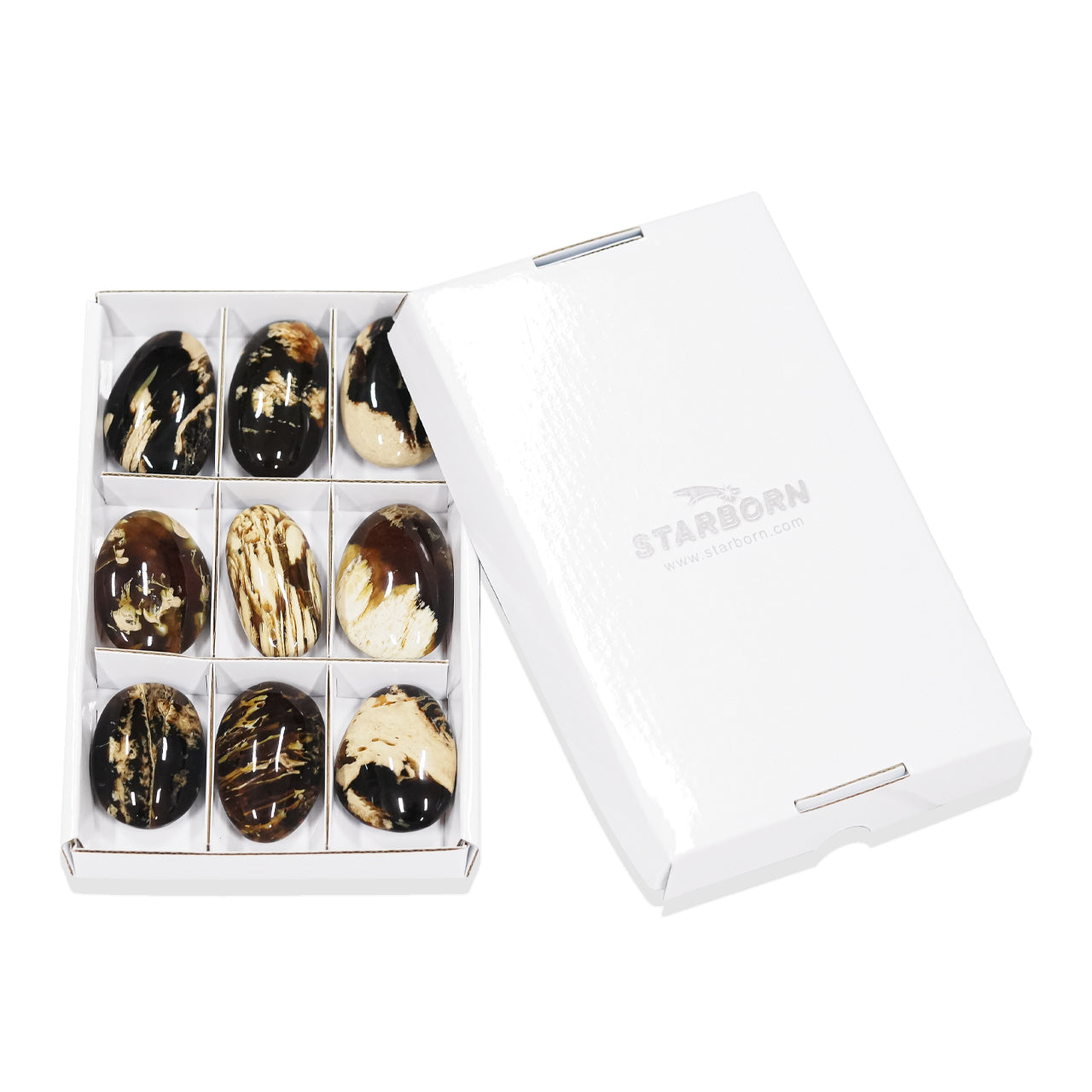 Boxed set of 9 pcs Milk & Honey Sumatra amber freeform palm stones arranged in a white box with dividers beside a closed white lid.