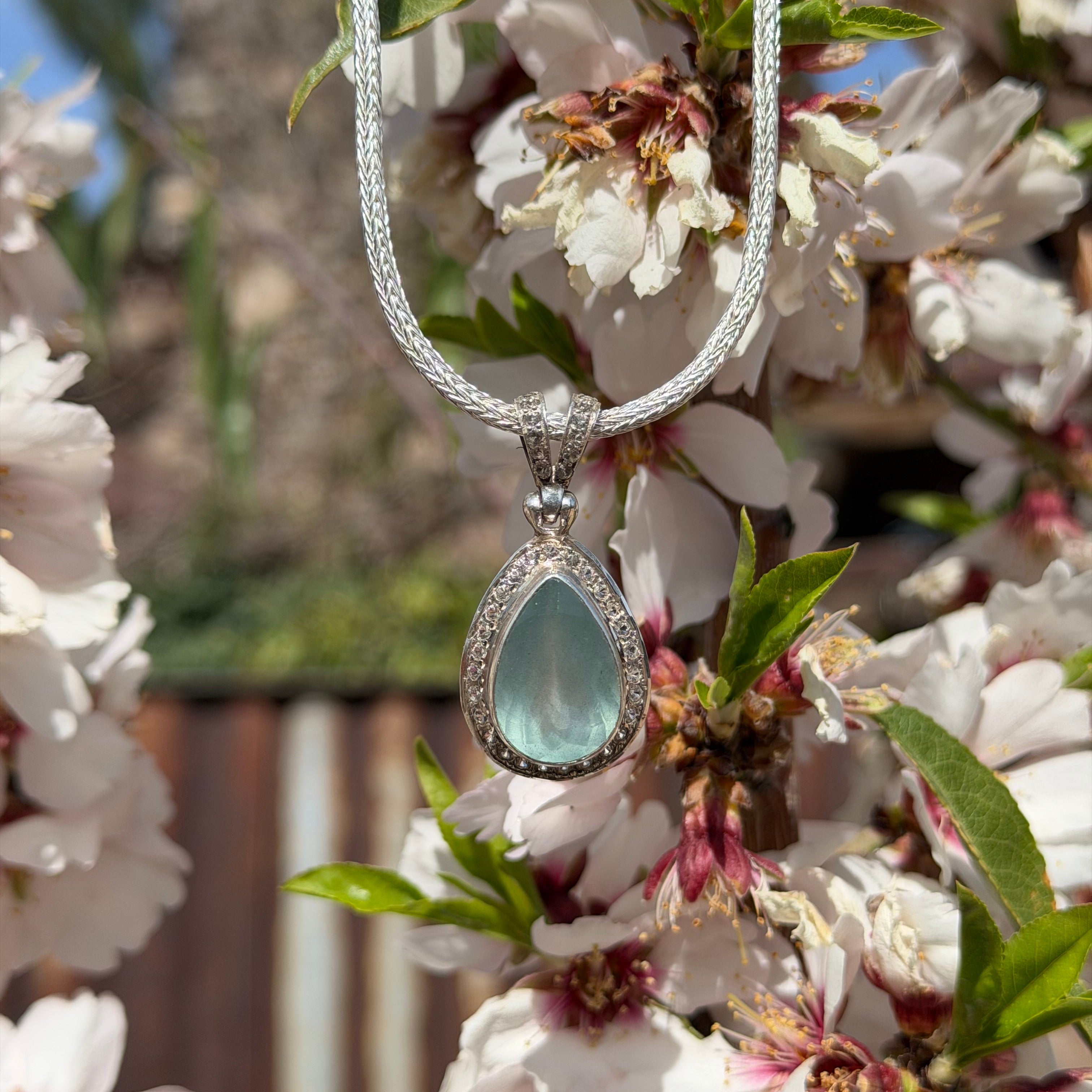 Starborn Aquamarine Pendant with Whie Topaz Pave Halo in Sterling Silver