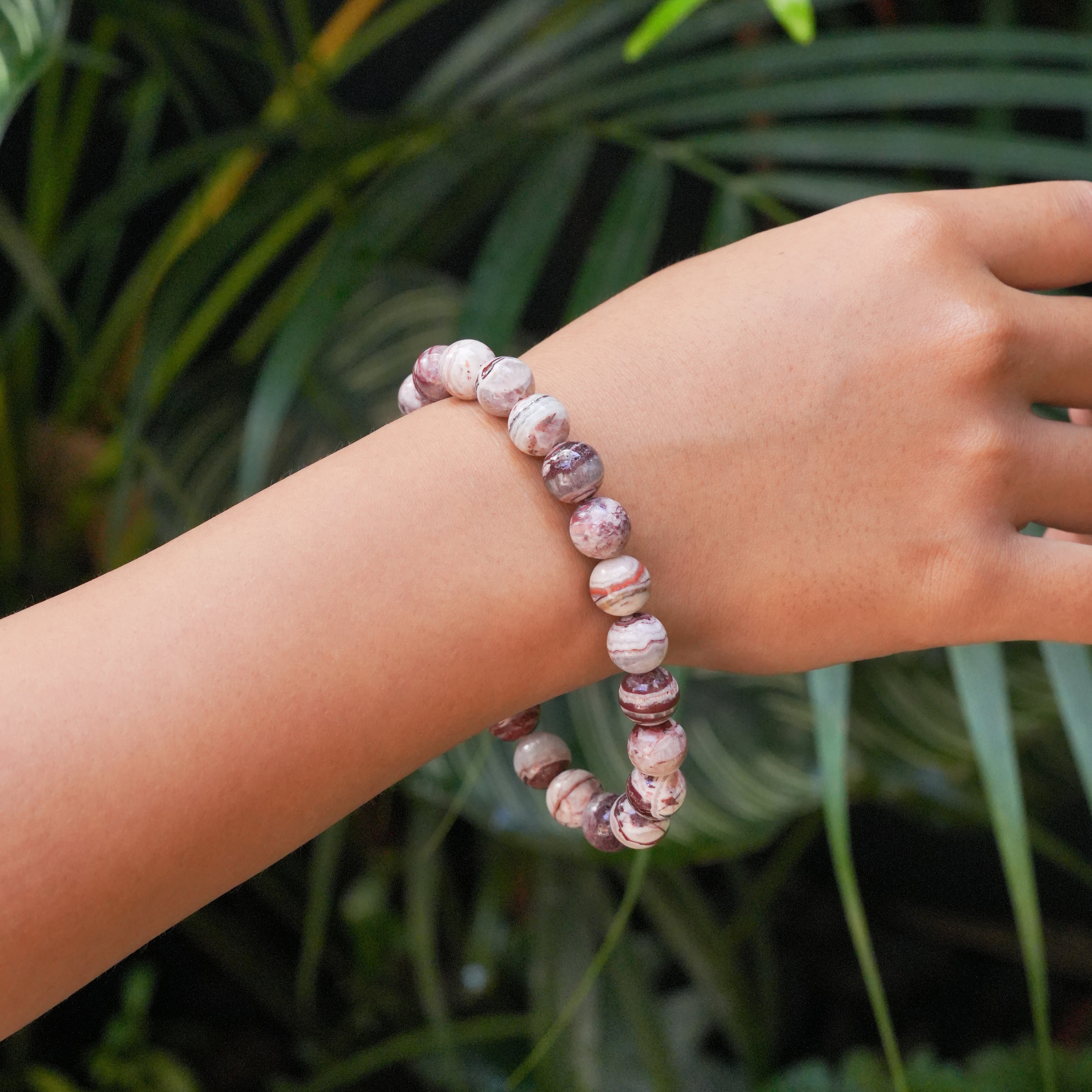 Arizona Agate Mountain bead bracelet worn on a wrist to for size reference.