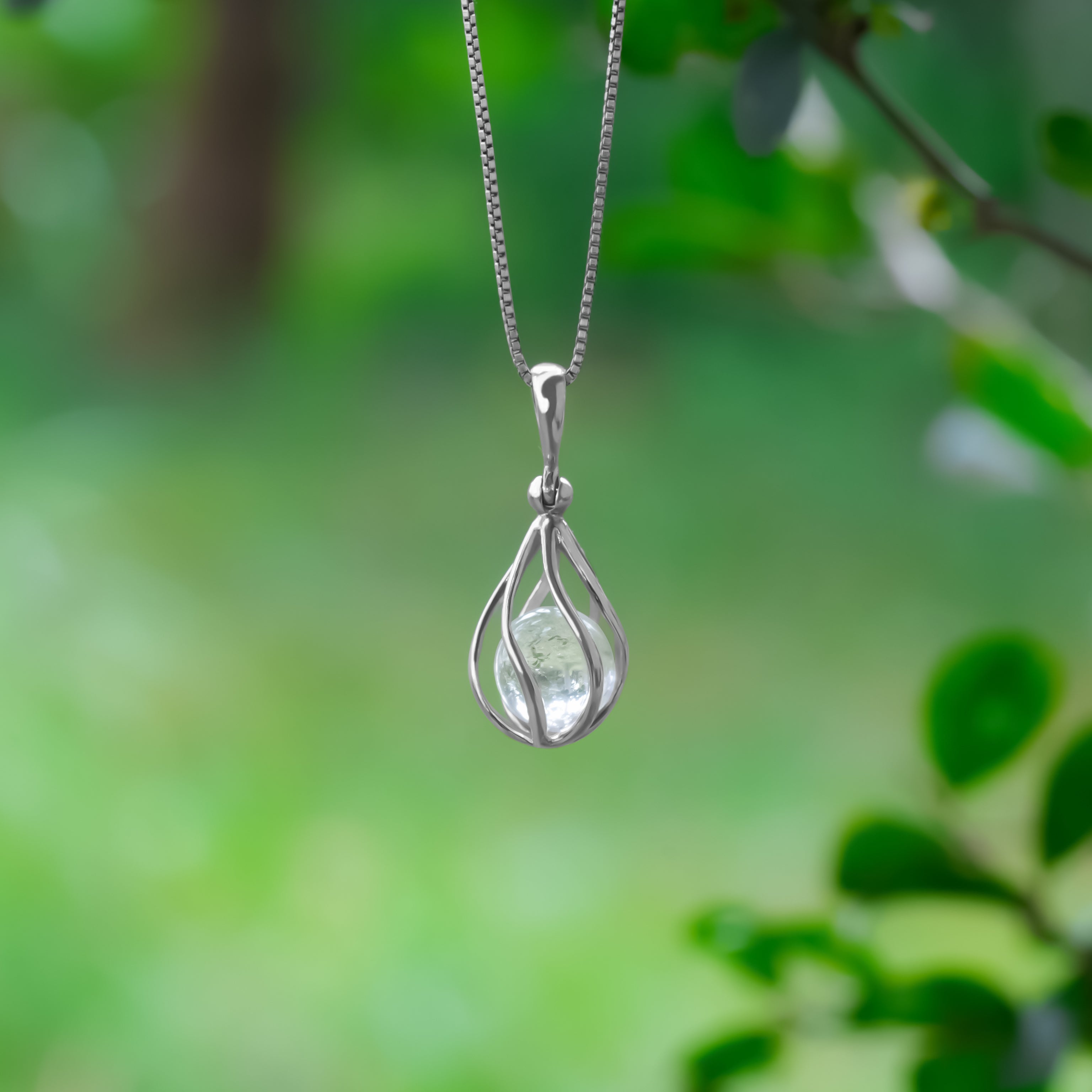 Starborn Danburite Sphere in Sterling Silver Cage Pendant