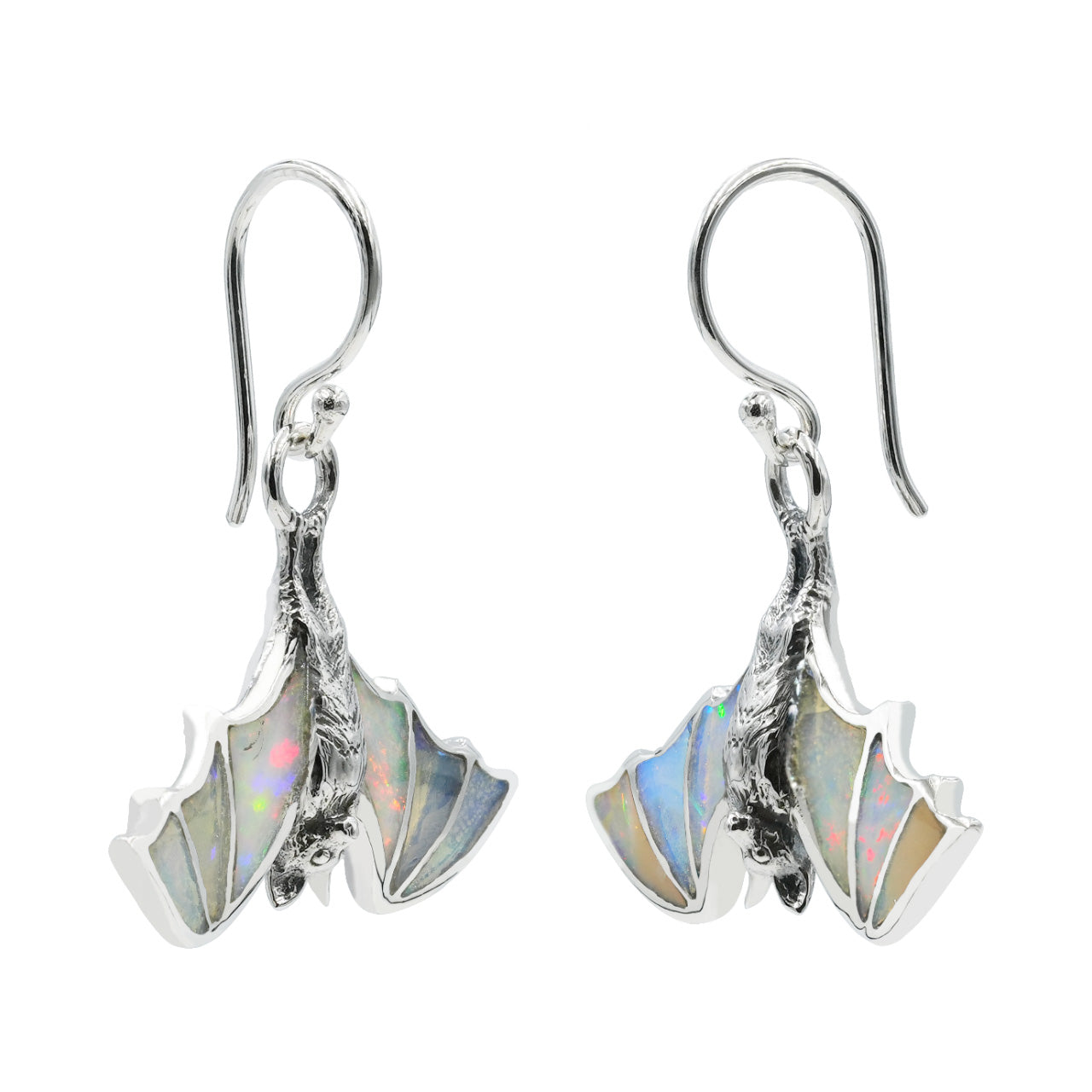Side view of hanging bat earrings with Ethiopian opal inlay showing the thickness of the setting and the sterling silver hook. 