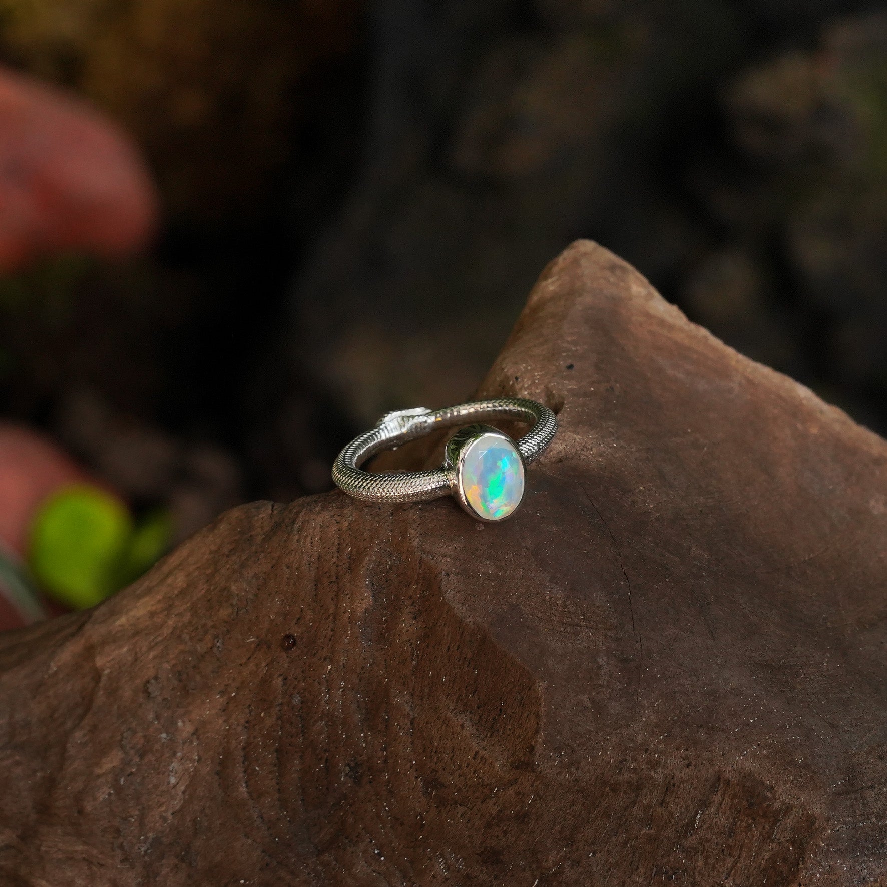 Starborn Ouroboros Ring with Faceted Natural Ethiopian Opal in Sterling Silver