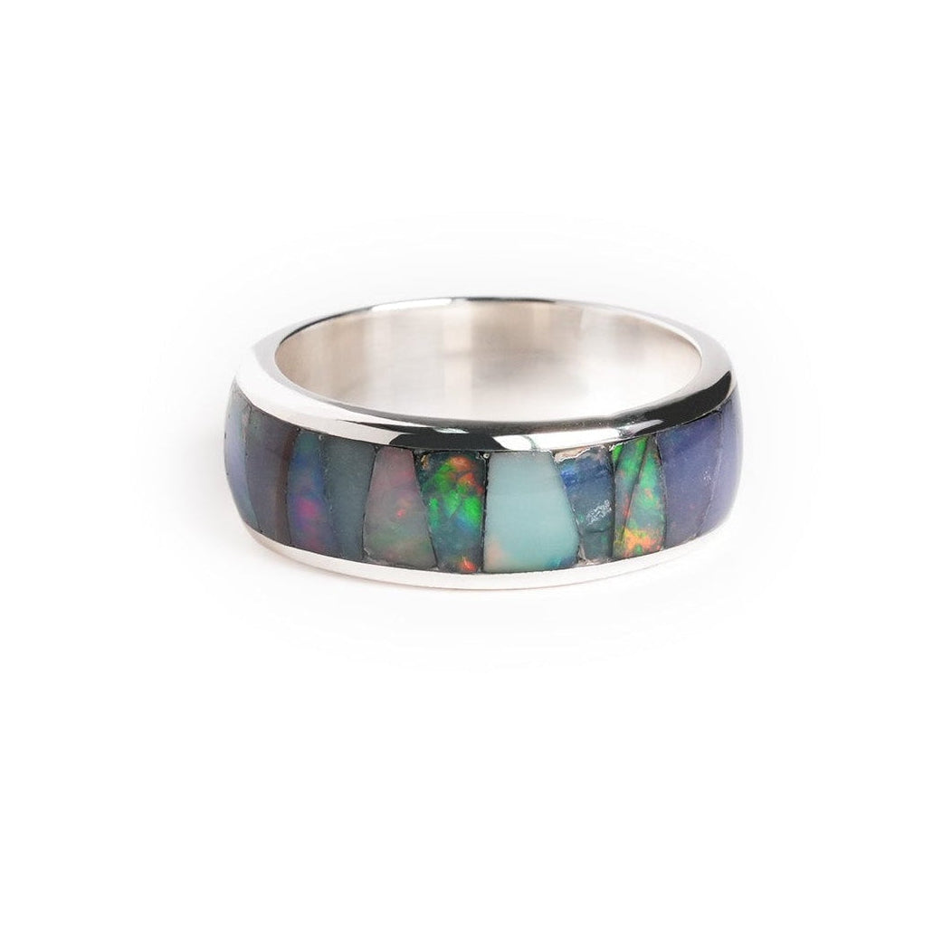 Second alternate front view of a channel ring with Ethiopian opal inlay showing green, blue, and pink play‑of‑color