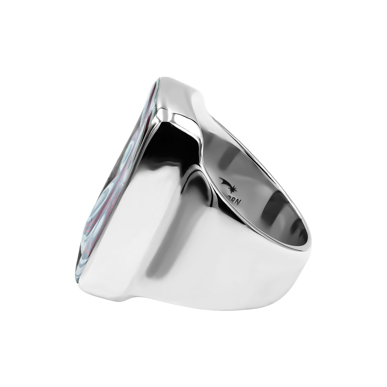 Side view of the fordite ring showing the thickness of the setting and the smoothly tapered band.