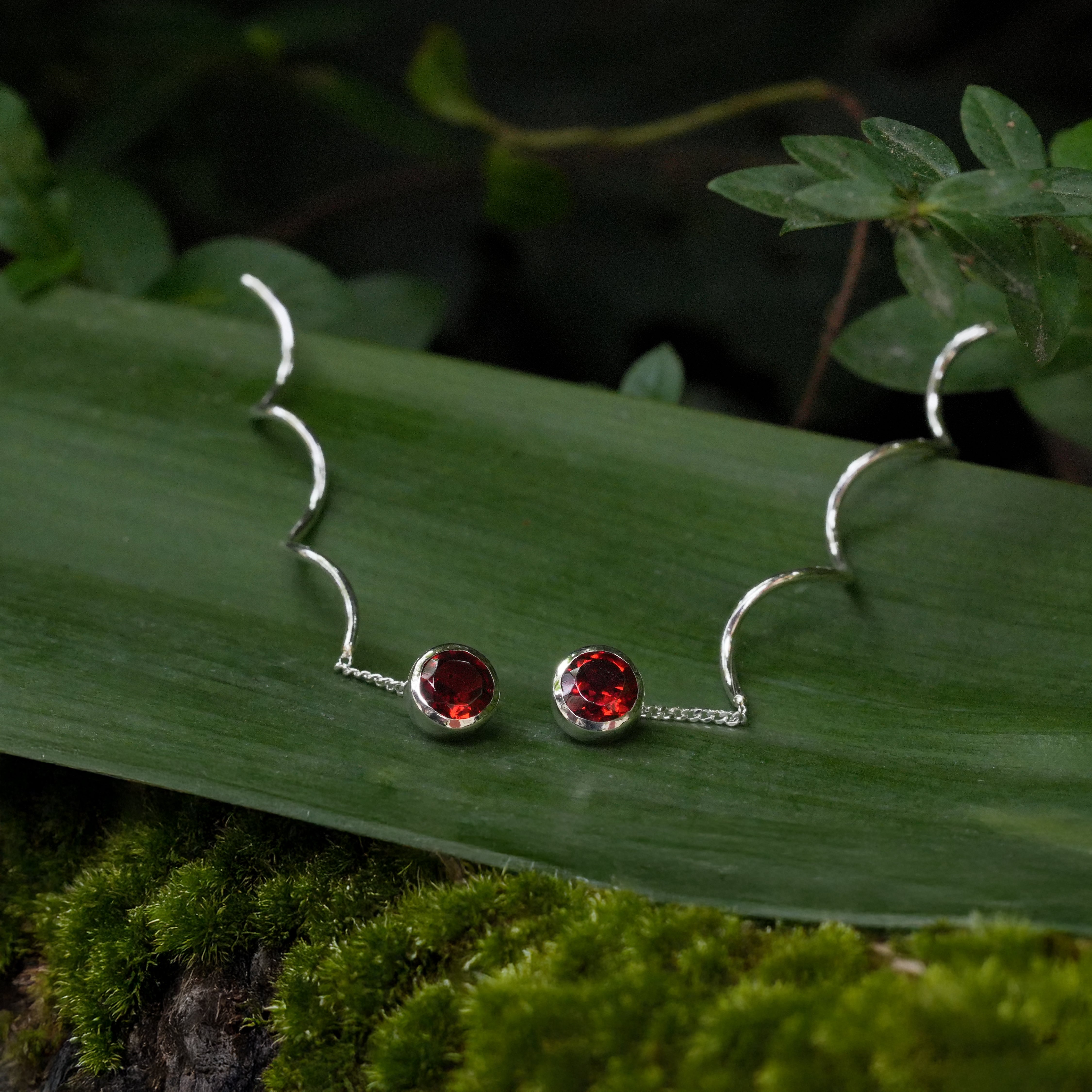 Starborn Faceted Garnet Stud Earrings with Flowing Curled Wire Drop in Sterling Silver