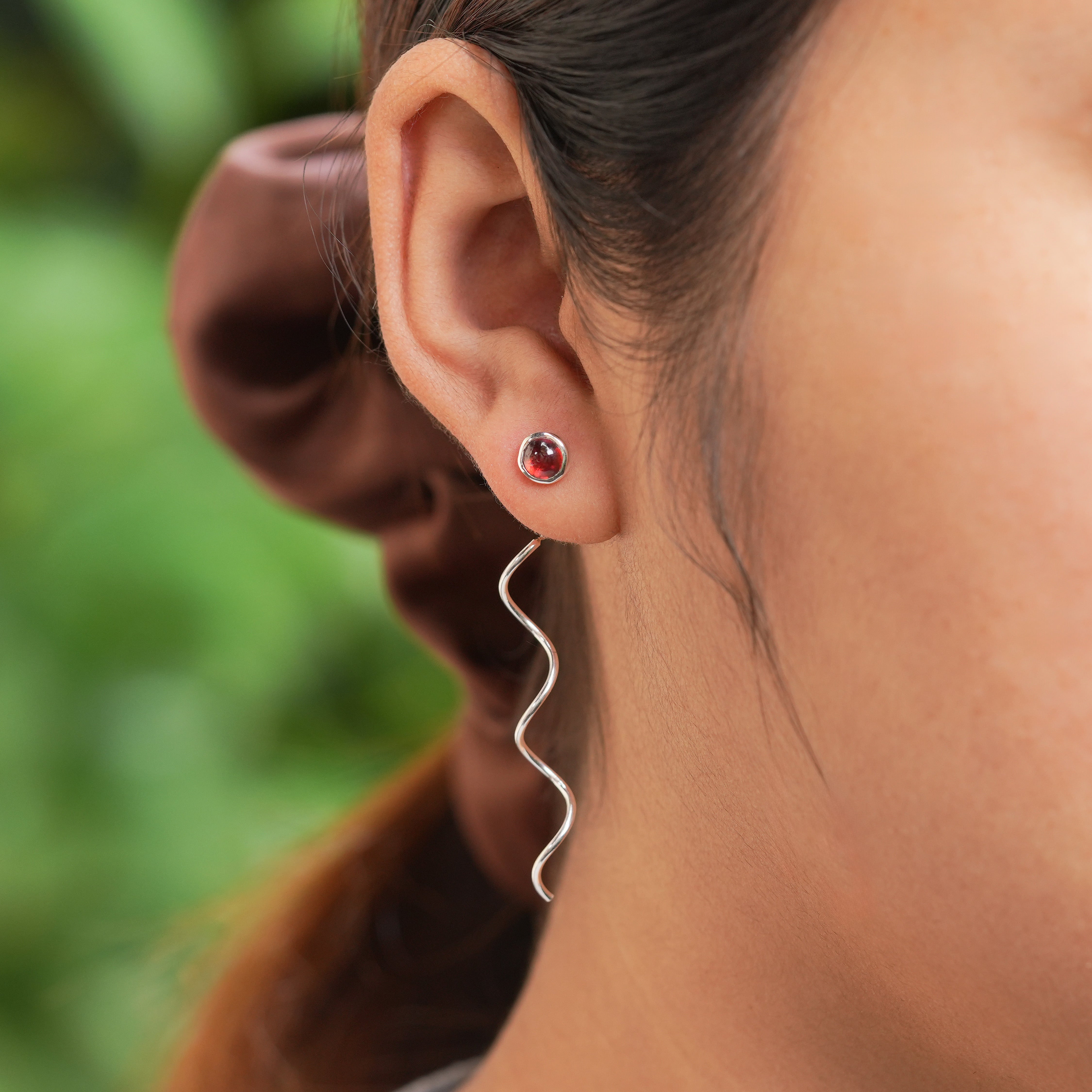 Starborn Polished Garnet Stud Earrings with Flowing Curled Wire Drop in Sterling Silver
