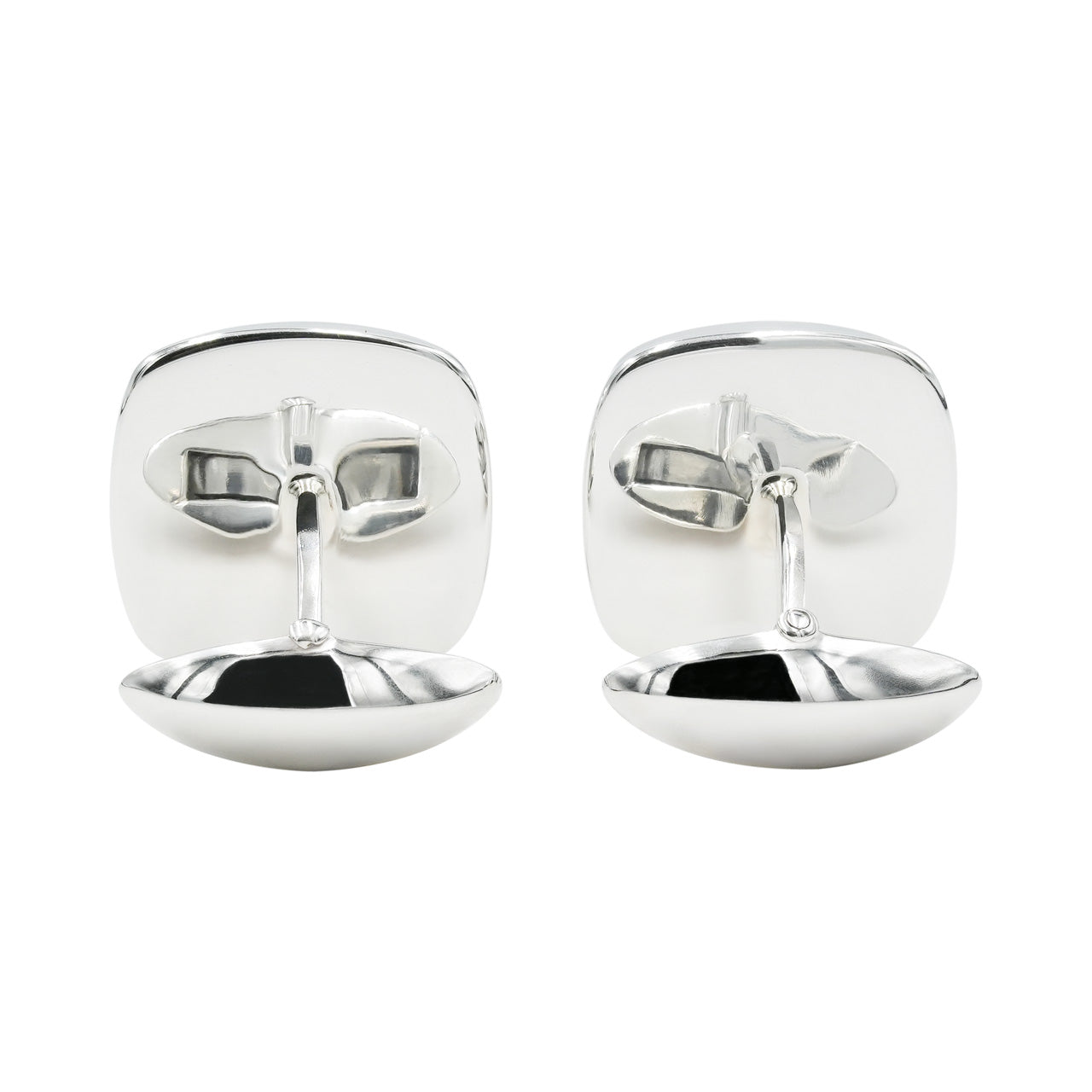 Back view of the cufflinks showing the polished silver backs and toggle closures attached to the square settings.