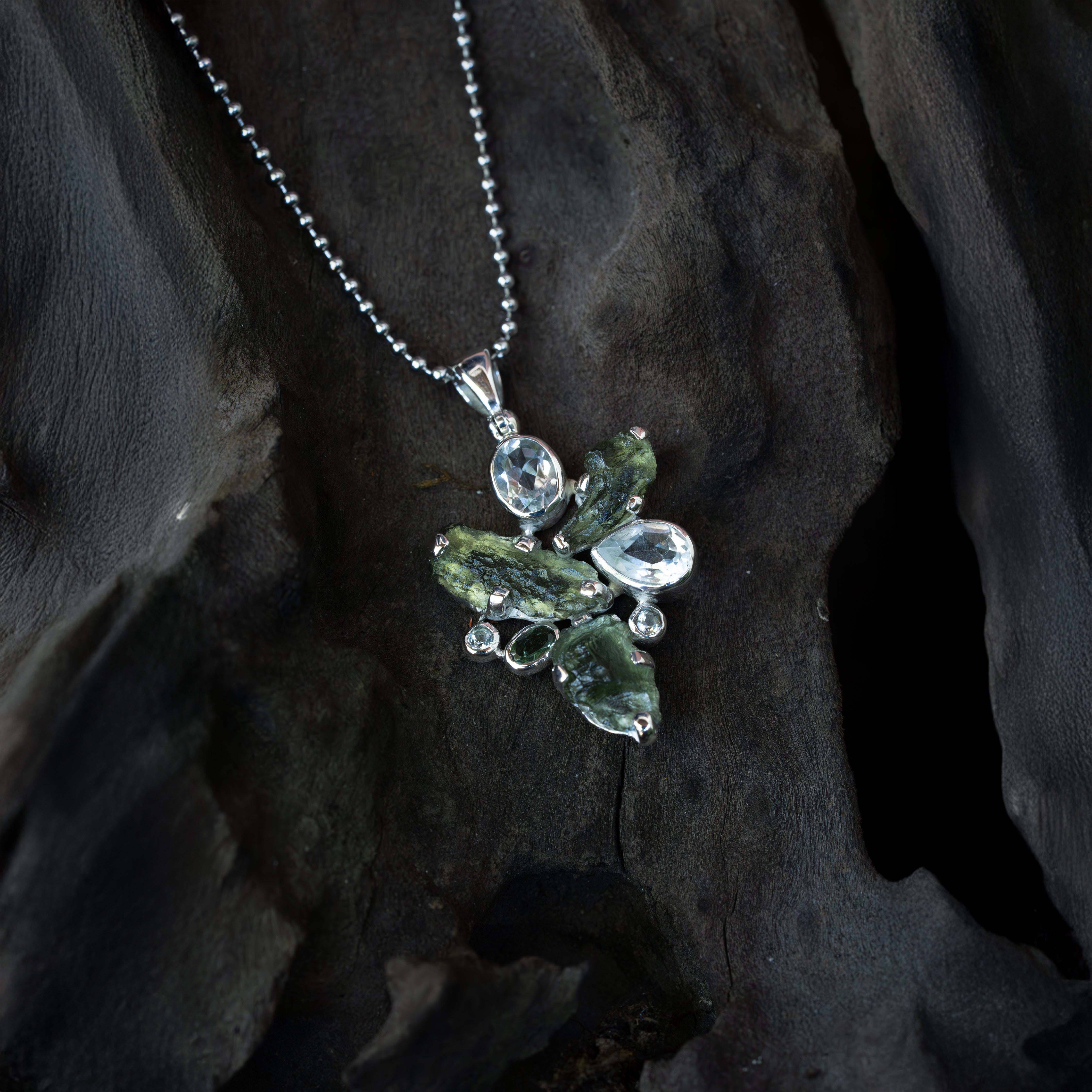 Starborn Moldavite Pendant with White Topaz Accents in Sterling Silver