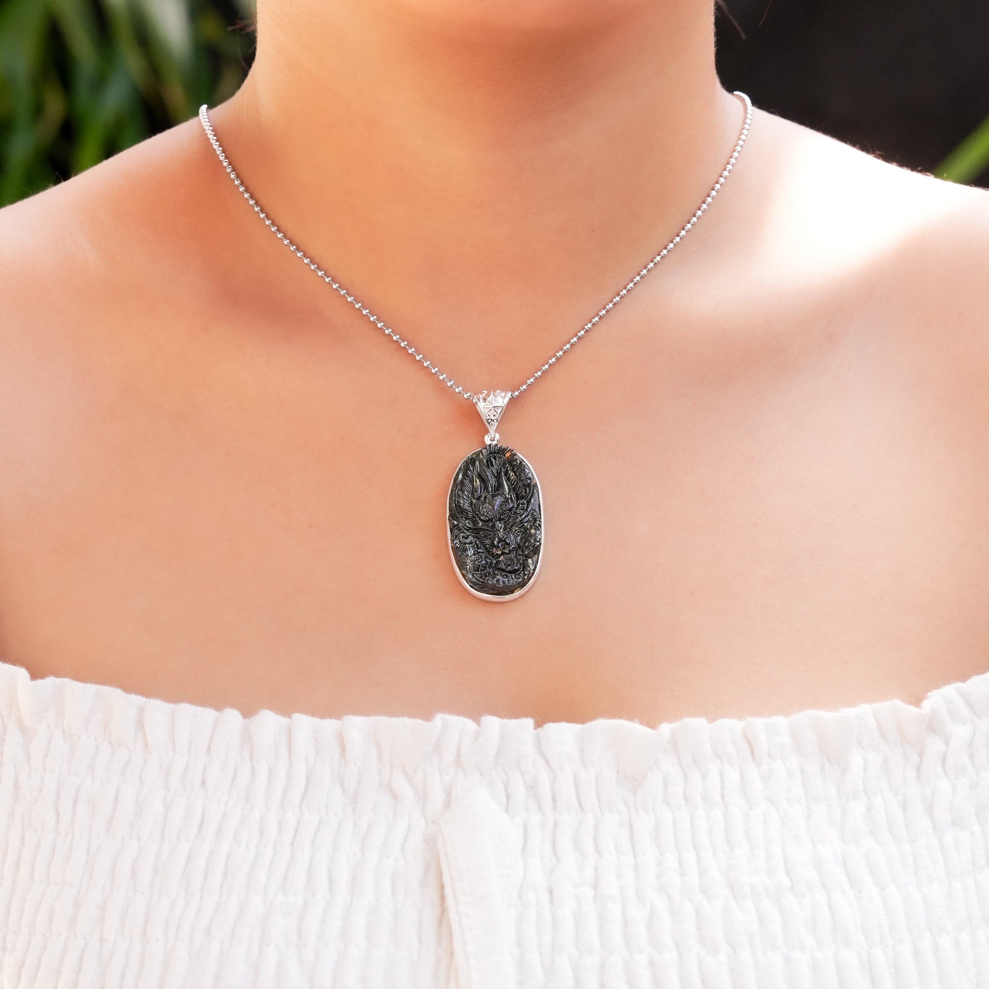 Starborn Nuumite Dragon Carving Pendant in Sterling Silver