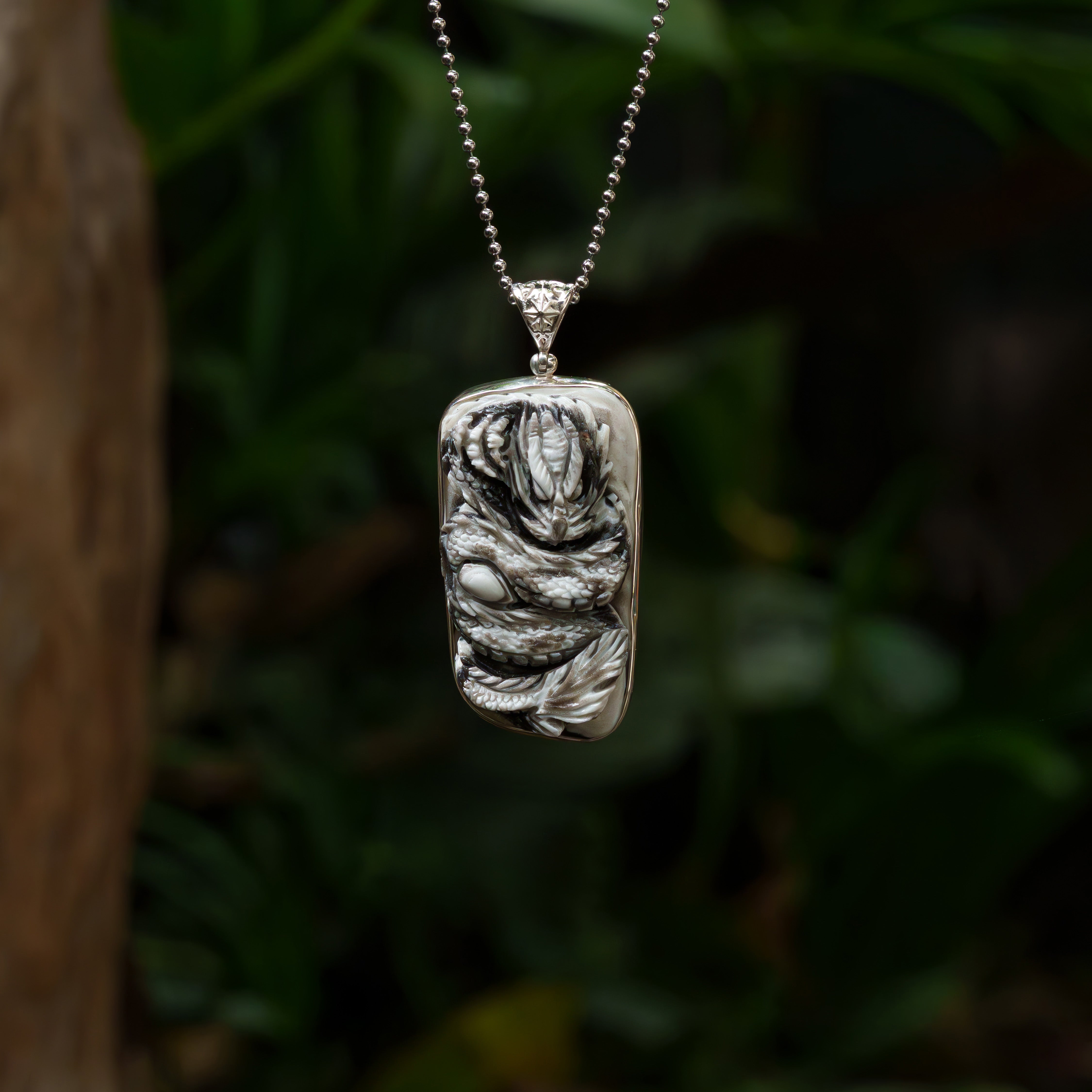 Starborn Hand-Carved Zebra Calcite Dragon Carving Pendant in Sterling Silver