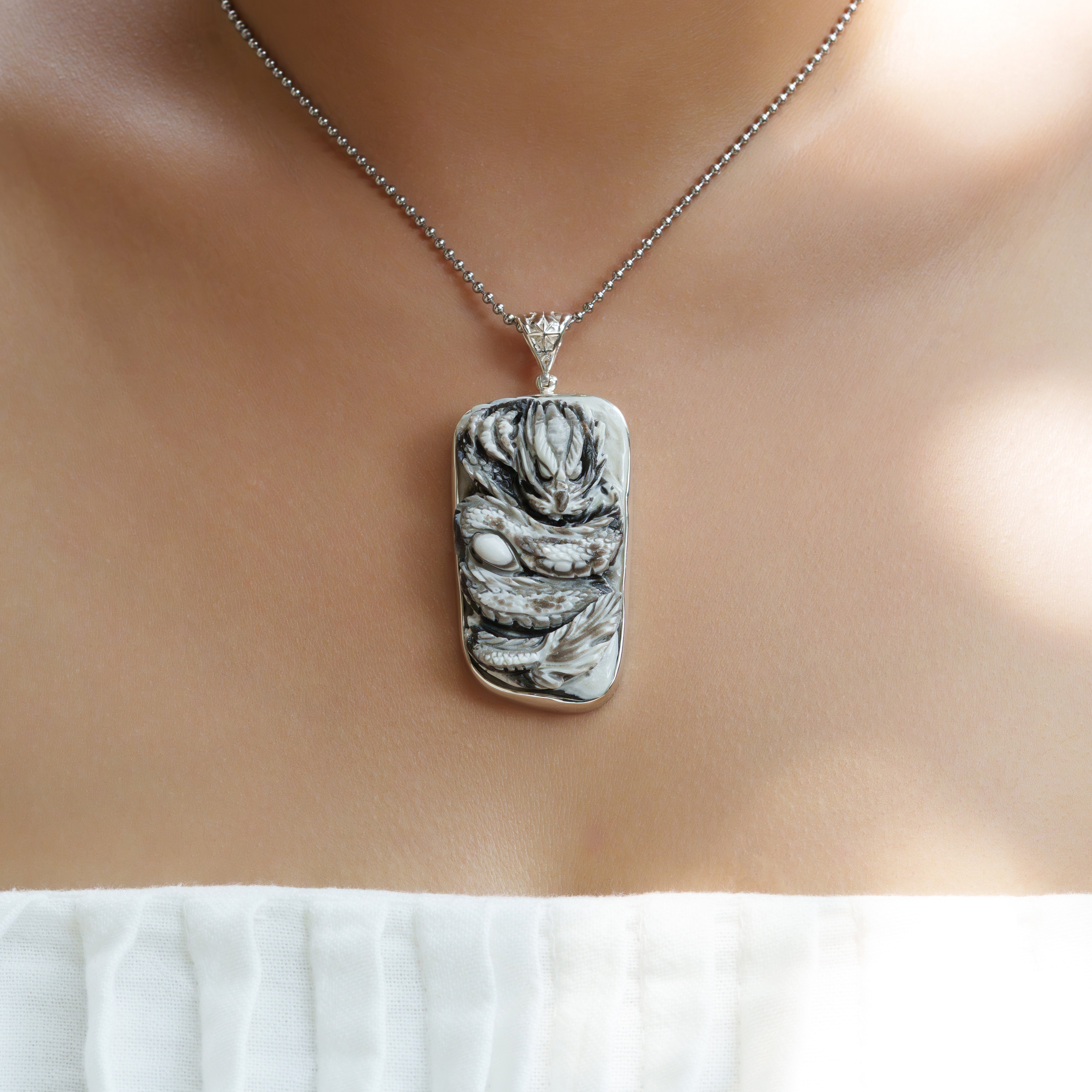 Starborn Hand-Carved Zebra Calcite Dragon Carving Pendant in Sterling Silver