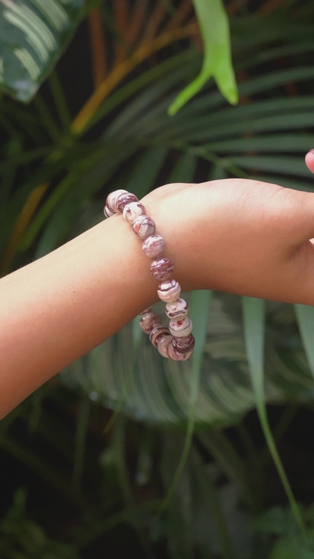 Video of the Arizona agate mountain bead bracelet worn on a wrist for size reference.