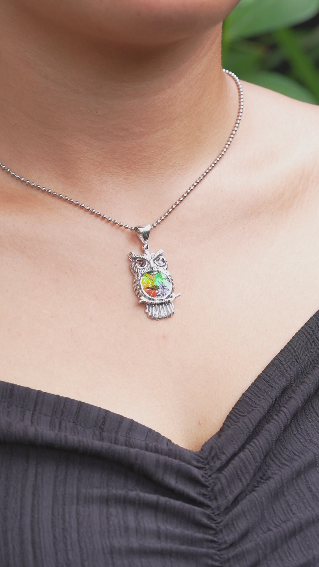 Video showing the owl pendant necklace worn for size reference.