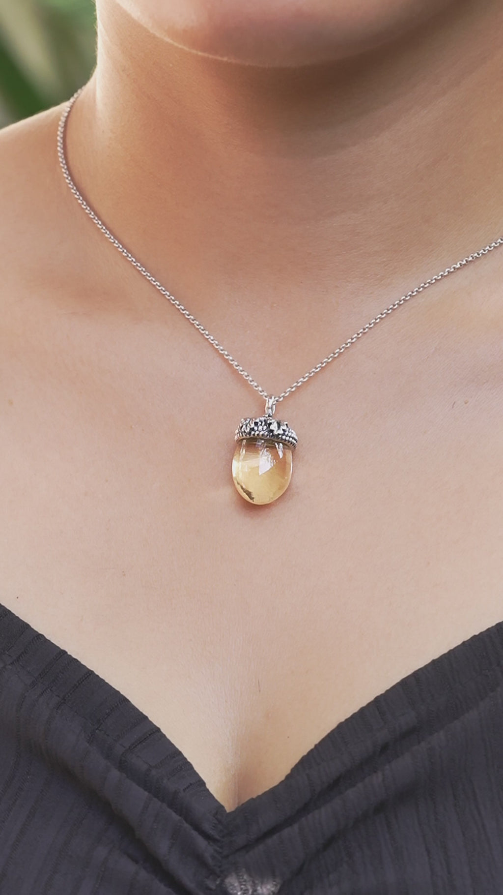 Video showing the citrine acorn pendant worn on a necklace, demonstrating how the pendant moves and hangs when worn.