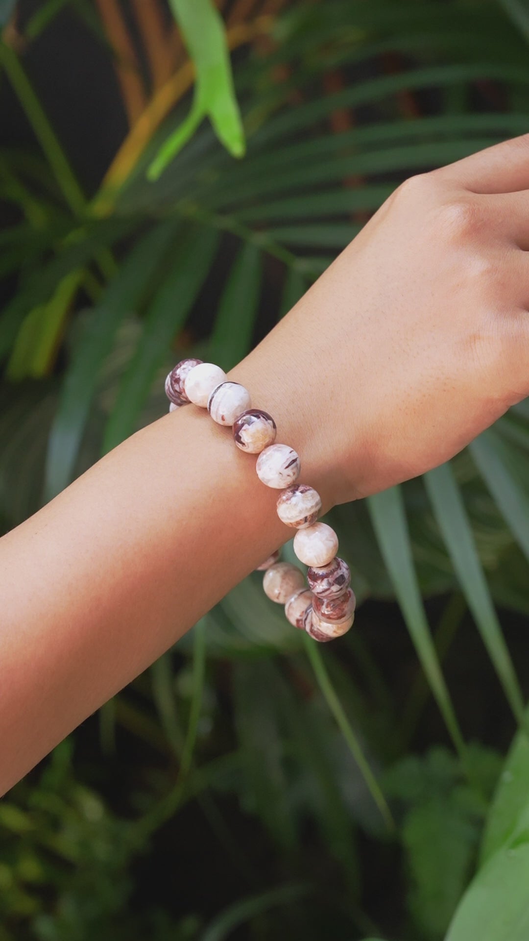 Video of the Arizona agate mountain bead bracelet worn on a wrist for size reference.