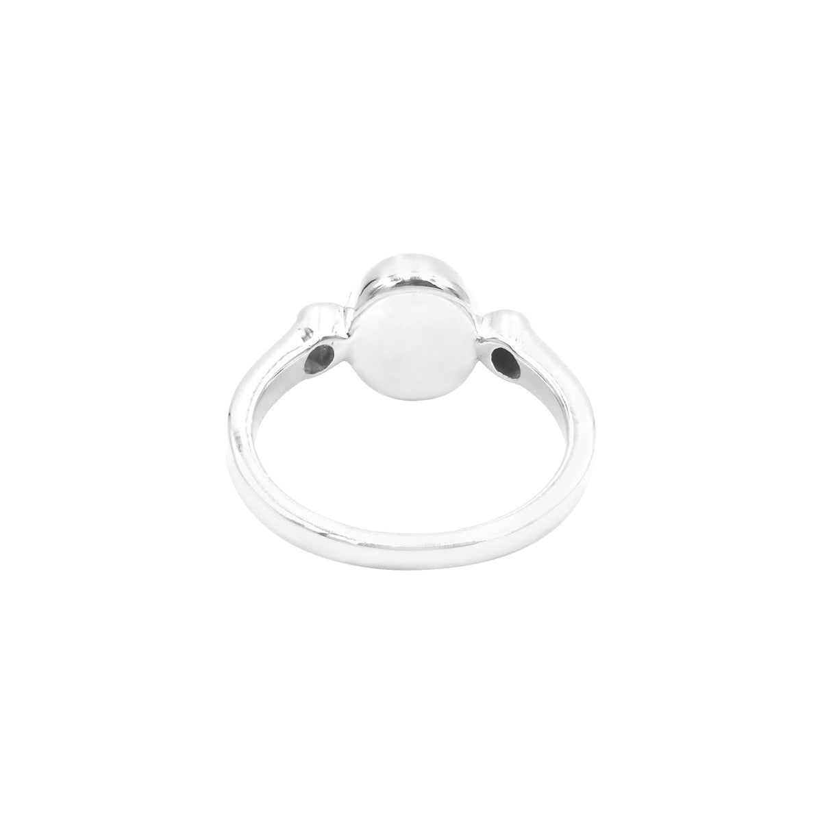 Back view of the ring showing the underside of the setting and the continuous sterling silver band forming a circular shape.